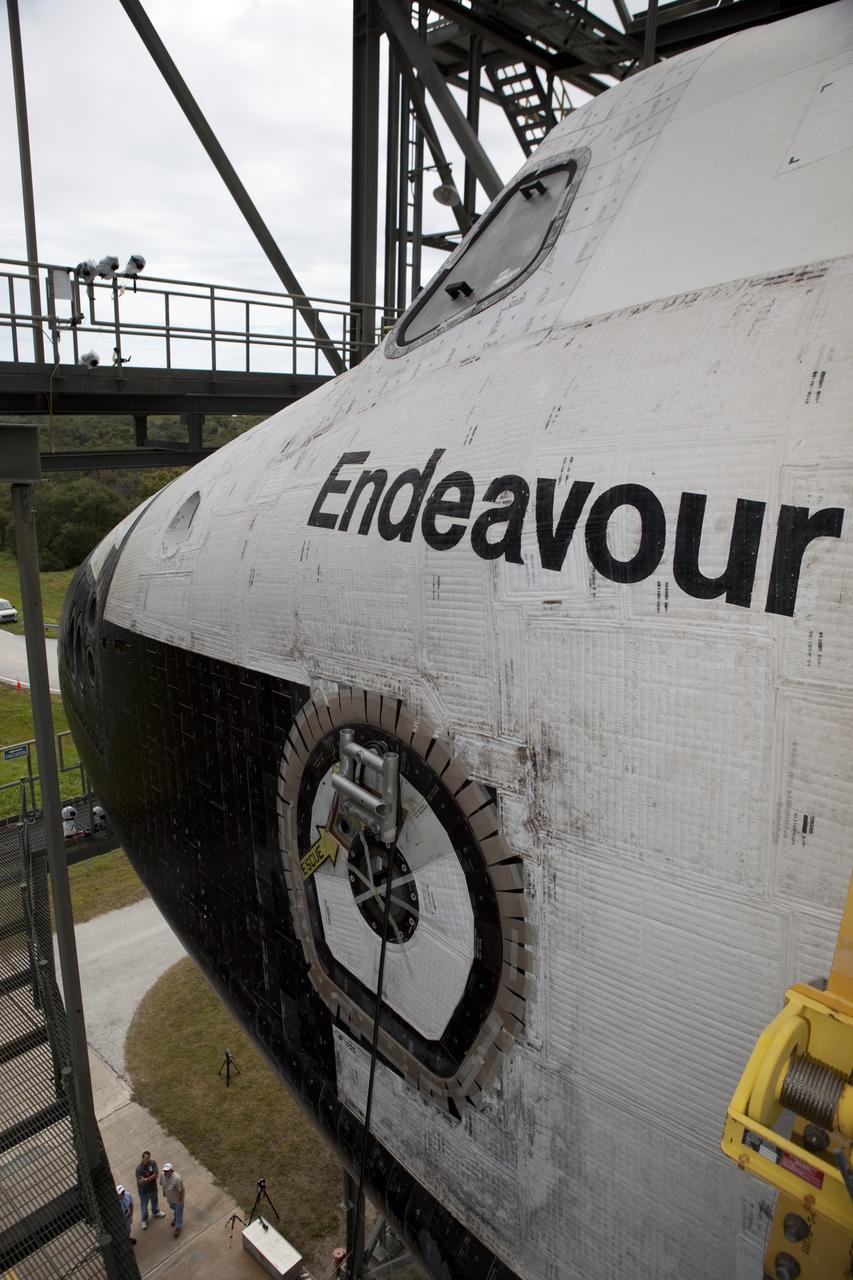 CAPE CANAVERAL, Fla. – Space shuttle Endeavour is hoisted above the ground by the mate-demate device at the Shuttle Landing Facility at NASA's Kennedy Space Center in Florida. The shuttle will be positioned and connected atop NASA's Shuttle Carrier Aircraft, or SCA, with the aid of the device. The SCA, a modified 747 jetliner, will fly Endeavour to Los Angeles where it will be placed on public display at the California Science Center. This is the final ferry flight scheduled in the Space Shuttle Program era. For more information on the shuttles' transition and retirement, visit http://www.nasa.gov/transition. Photo credit: NASA/Dimitri Gerondidakis