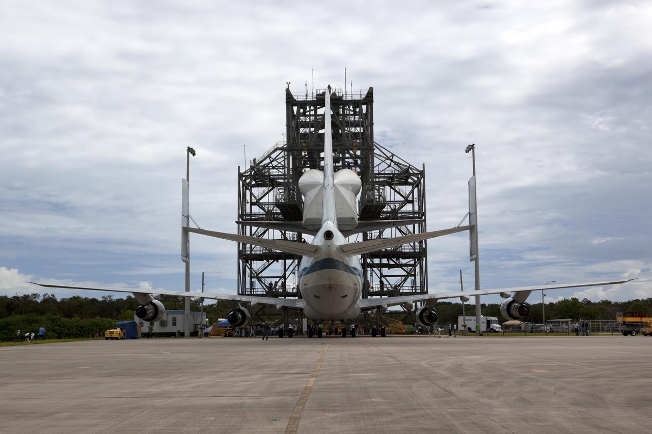 CAPE CANAVERAL, Fla. – NASA's Shuttle Carrier Aircraft, or SCA, is positioned beneath space shuttle Endeavour, suspended in the mate-demate device at the Shuttle Landing Facility at NASA's Kennedy Space Center in Florida. The shuttle will be lowered and connected to the top of the SCA with the support of the device. The shuttle has been fitted with an aerodynamic tailcone for its upcoming ferry flight. The SCA, a modified 747 jetliner, will fly Endeavour to Los Angeles where it will be placed on public display at the California Science Center. This is the final ferry flight scheduled in the Space Shuttle Program era. For more information on the shuttles' transition and retirement, visit http://www.nasa.gov/transition. Photo credit: NASA/Dimitri Gerondidakis