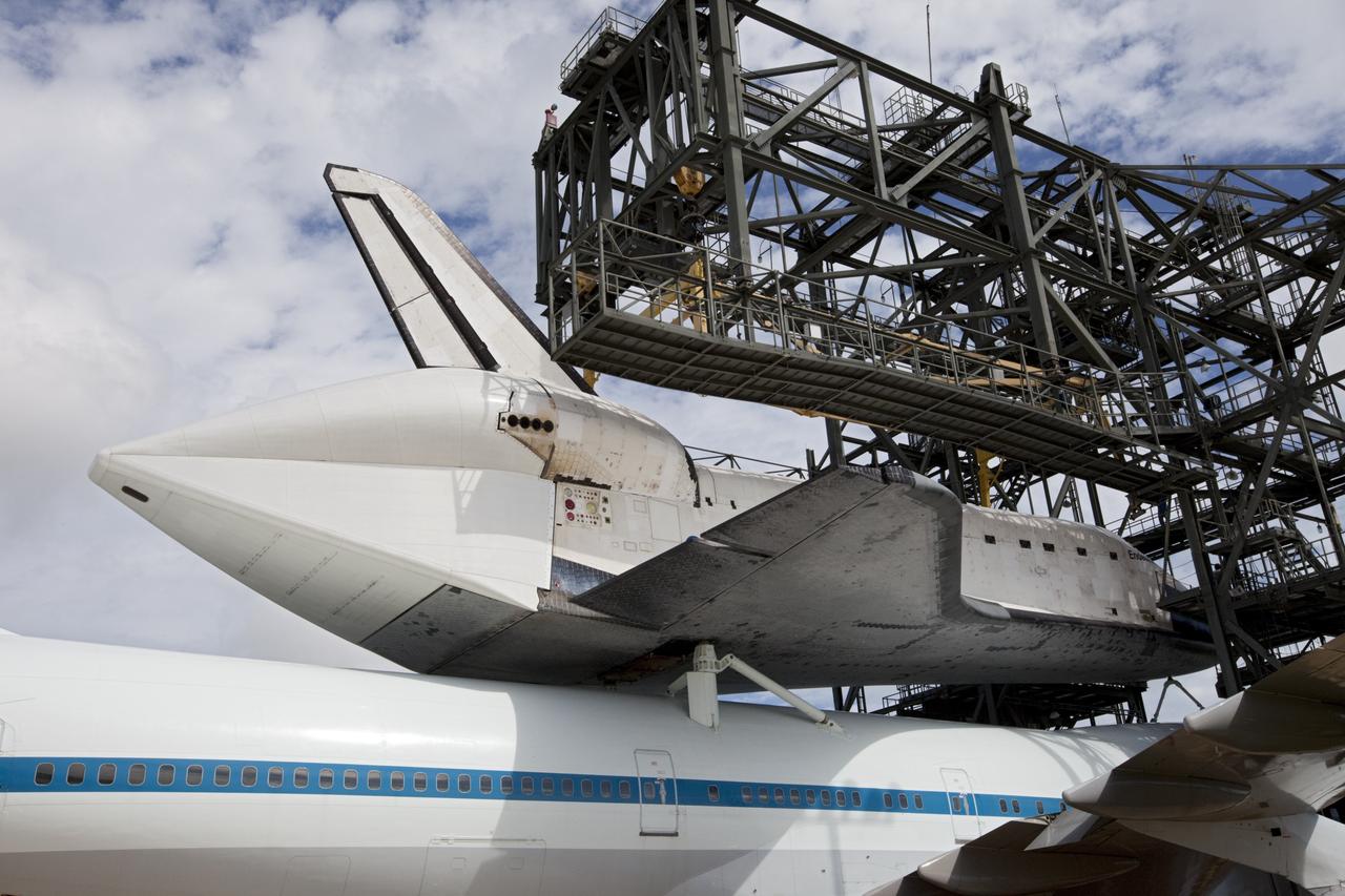CAPE CANAVERAL, Fla. – At the Shuttle Landing Facility at NASA's Kennedy Space Center in Florida, the space shuttle Endeavour, mounted atop NASA's Shuttle Carrier Aircraft, or SCA, is ready to roll back from the mate-demate device.      The SCA, a modified 747 jetliner, will fly Endeavour to Los Angeles where it will be placed on public display at the California Science Center. This is the final ferry flight scheduled in the Space Shuttle Program era. For more information on the shuttles' transition and retirement, visit http://www.nasa.gov/transition.  Photo credit: NASA/ Kim Shiflett