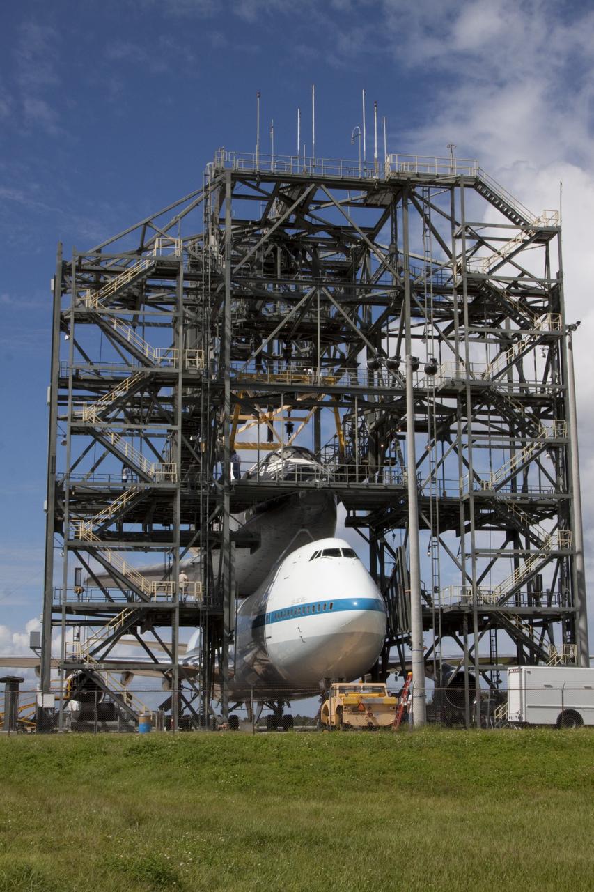 CAPE CANAVERAL, Fla. – At the Shuttle Landing Facility at NASA's Kennedy Space Center in Florida, the space shuttle Endeavour, mounted atop NASA's Shuttle Carrier Aircraft, or SCA, is ready to roll back from the mate-demate device.      The SCA, a modified 747 jetliner, will fly Endeavour to Los Angeles where it will be placed on public display at the California Science Center. This is the final ferry flight scheduled in the Space Shuttle Program era. For more information on the shuttles' transition and retirement, visit http://www.nasa.gov/transition.  Photo credit: NASA/ Kim Shiflett