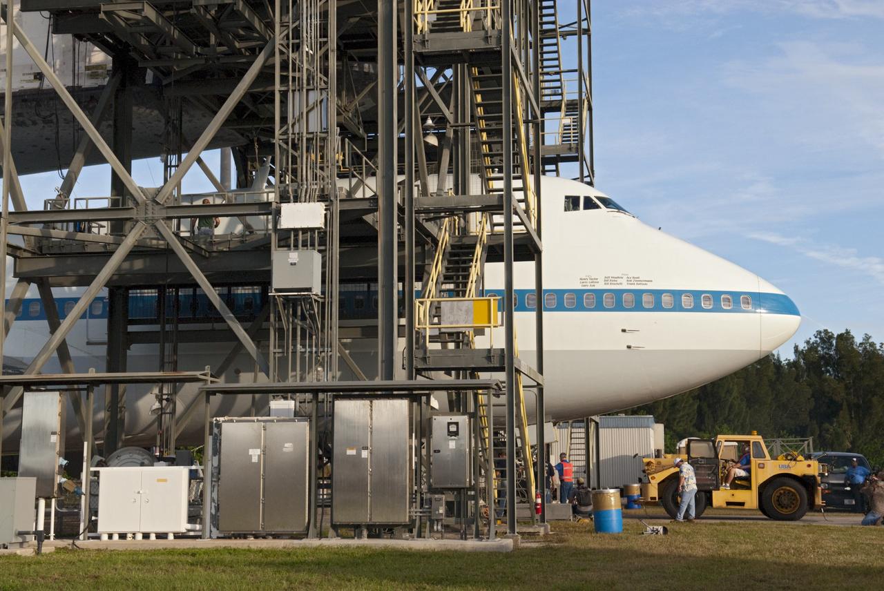 CAPE CANAVERAL, Fla. - At the Shuttle Landing Facility at NASA's Kennedy Space Center in Florida, preparations are under way to push NASA's Shuttle Carrier Aircraft, or SCA, from beneath the platforms of the mate-demate device. Space shuttle Endeavour has been secured atop the aircraft for its upcoming ferry flight. The SCA, a modified 747 jetliner, will fly Endeavour to Los Angeles where it will be placed on public display at the California Science Center. This is the final ferry flight scheduled in the Space Shuttle Program era. For more information on the shuttles' transition and retirement, visit http://www.nasa.gov/transition. Photo credit: NASA/Charisse Nahser