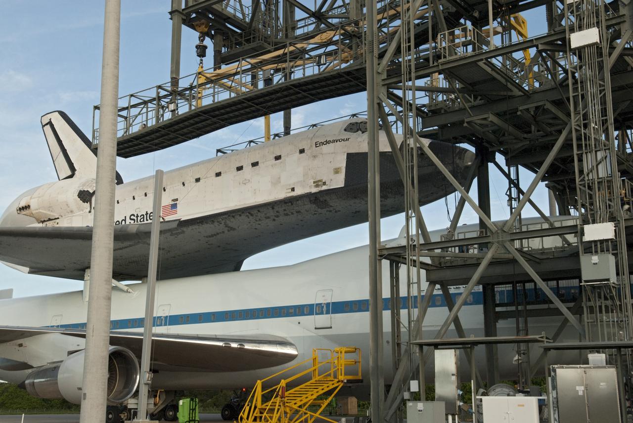 CAPE CANAVERAL, Fla. – NASA's Shuttle Carrier Aircraft, or SCA, rolls from beneath the mate-demate device at the Shuttle Landing Facility at NASA's Kennedy Space Center in Florida with space shuttle Endeavour secured on its back.     The SCA, a modified 747 jetliner, will fly Endeavour to Los Angeles where it will be placed on public display at the California Science Center. This is the final ferry flight scheduled in the Space Shuttle Program era. For more information on the shuttles' transition and retirement, visit http://www.nasa.gov/transition.  Photo credit: NASA/Charisse Nahser