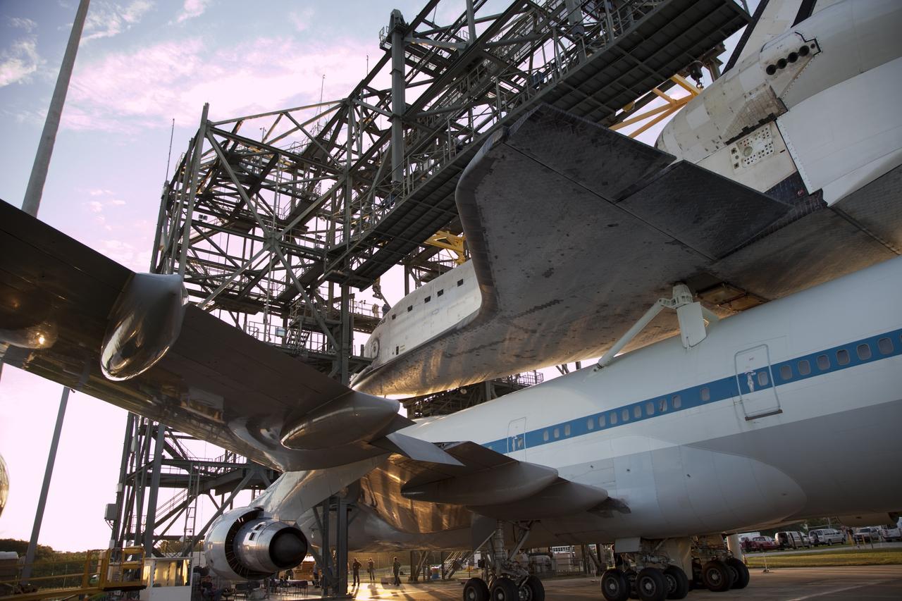 CAPE CANAVERAL, Fla. – NASA's Shuttle Carrier Aircraft, or SCA, rolls from beneath the mate-demate device at the Shuttle Landing Facility at NASA's Kennedy Space Center in Florida with space shuttle Endeavour secured on its back.    The SCA, a modified 747 jetliner, will fly Endeavour to Los Angeles where it will be placed on public display at the California Science Center. This is the final ferry flight scheduled in the Space Shuttle Program era. For more information on the shuttles' transition and retirement, visit http://www.nasa.gov/transition.  Photo credit: NASA/Frankie Martin