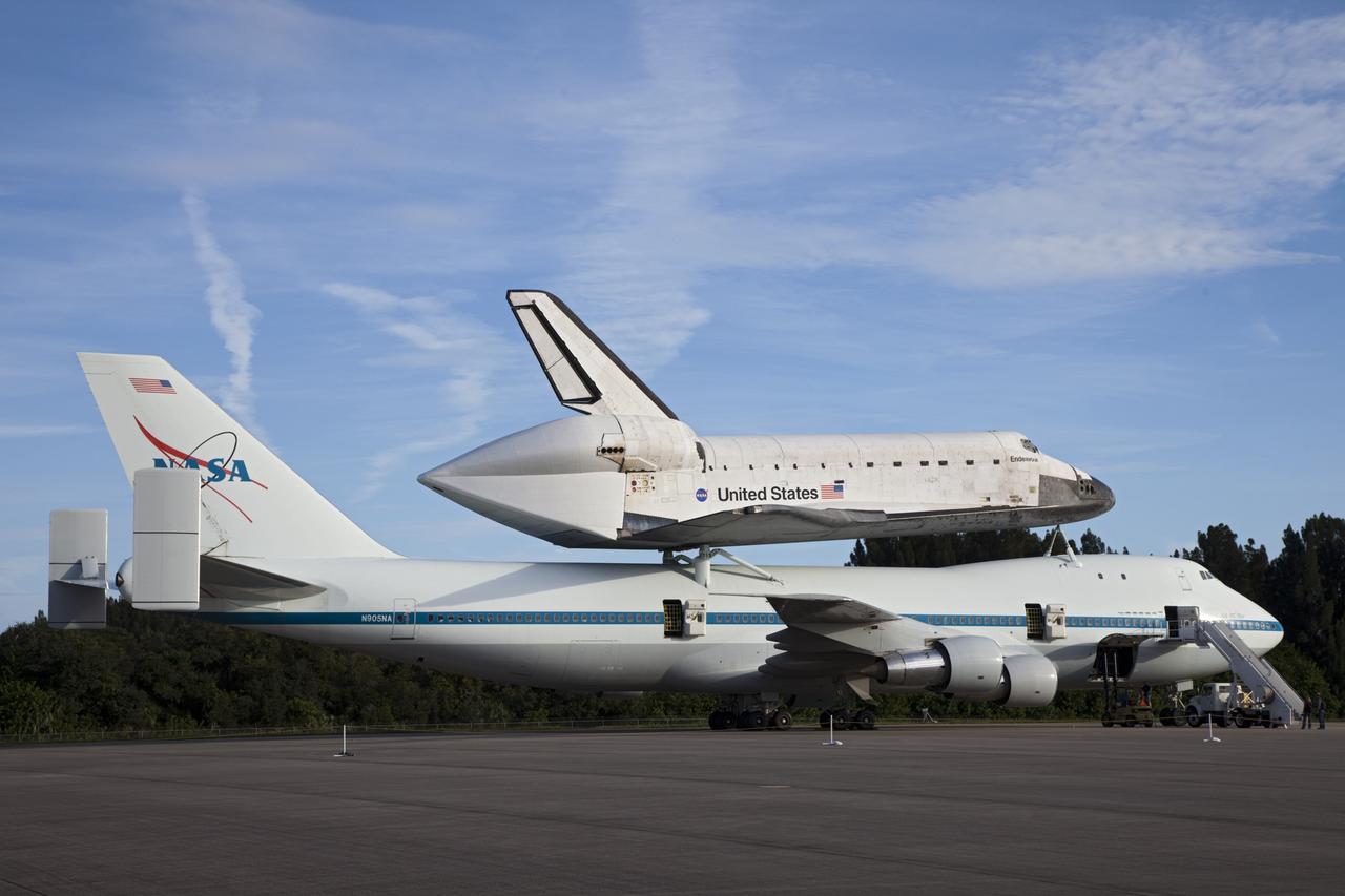 CAPE CANAVERAL, Fla. – NASA's Shuttle Carrier Aircraft, or SCA, is parked on the apron of the Shuttle Landing Facility at NASA's Kennedy Space Center in Florida with space shuttle Endeavour secured on its back.    The SCA, a modified 747 jetliner, will fly Endeavour to Los Angeles where it will be placed on public display at the California Science Center. This is the final ferry flight scheduled in the Space Shuttle Program era. For more information on the shuttles' transition and retirement, visit http://www.nasa.gov/transition.  Photo credit: NASA/Frankie Martin