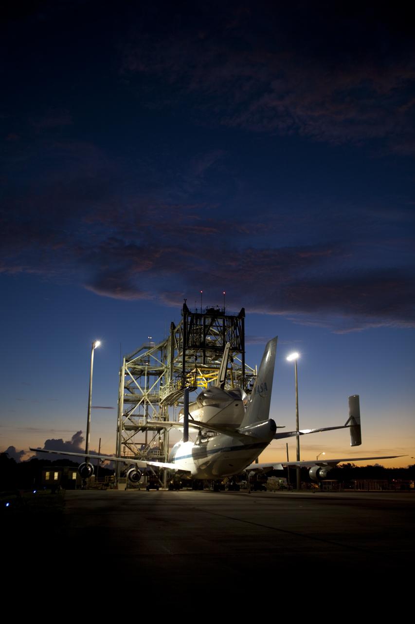 CAPE CANAVERAL, Fla. – As the sun rises at the Shuttle Landing Facility at NASA's Kennedy Space Center in Florida, preparations are under way to back NASA's Shuttle Carrier Aircraft, or SCA, away from the mate-demate device.  Space shuttle Endeavour has been fitted with an aerodynamic tailcone and secured atop the aircraft for its upcoming ferry flight.    The SCA, a modified 747 jetliner, will fly Endeavour to Los Angeles where it will be placed on public display at the California Science Center. This is the final ferry flight scheduled in the Space Shuttle Program era. For more information on the shuttles' transition and retirement, visit http://www.nasa.gov/transition.  Photo credit: NASA/Dimitri Gerondidakis