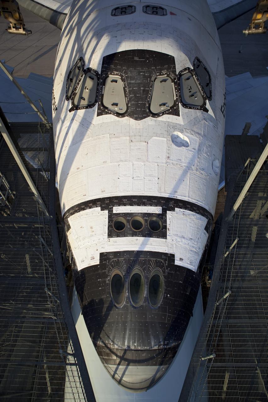 CAPE CANAVERAL, Fla. – At the Shuttle Landing Facility at NASA's Kennedy Space Center in Florida, platforms on the mate-demate device surround space shuttle Endeavour as preparations are made to roll the Shuttle Carrier Aircraft, or SCA, to which the shuttle is secured away from the structure. The SCA, a modified 747 jetliner, will fly Endeavour to Los Angeles where it will be placed on public display at the California Science Center. This is the final ferry flight scheduled in the Space Shuttle Program era. For more information on the shuttles' transition and retirement, visit http://www.nasa.gov/transition. Photo credit: NASA/Dimitri Gerondidakis