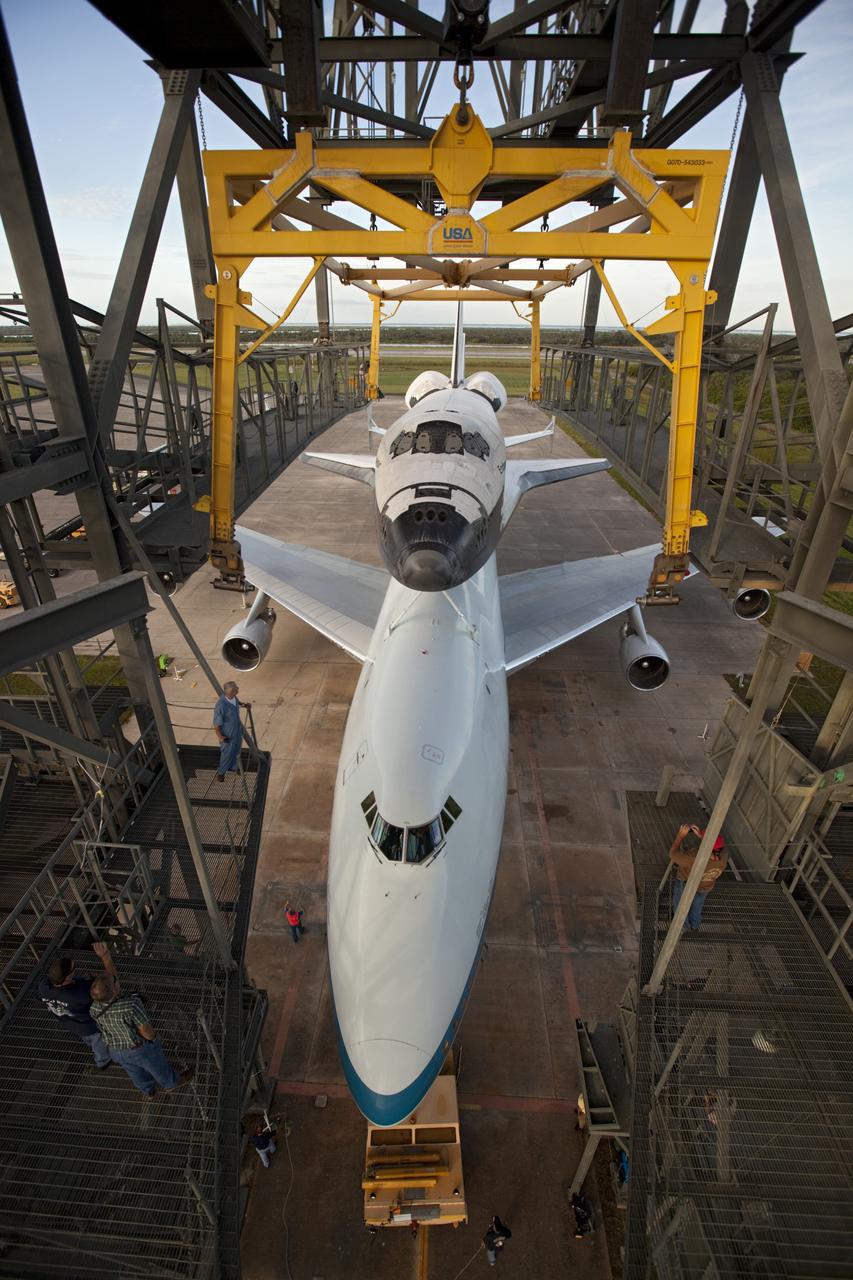 CAPE CANAVERAL, Fla. – Space shuttle Endeavour is detached from the mate-demate device at the Shuttle Landing Facility at NASA's Kennedy Space Center in Florida. Preparations are under way to push Endeavour and the Shuttle Carrier Aircraft, or SCA, to which it is secured away from the structure. The SCA, a modified 747 jetliner, will fly Endeavour to Los Angeles where it will be placed on public display at the California Science Center. This is the final ferry flight scheduled in the Space Shuttle Program era. For more information on the shuttles' transition and retirement, visit http://www.nasa.gov/transition. Photo credit: NASA/Dimitri Gerondidakis