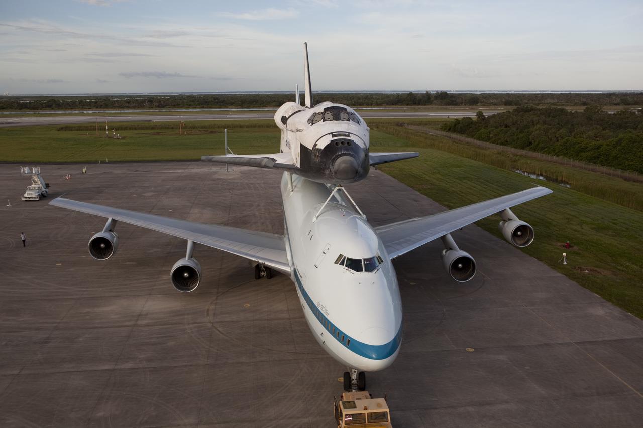 CAPE CANAVERAL, Fla. – Space shuttle Endeavour, secured atop NASA's Shuttle Carrier Aircraft, or SCA, backs away from the mate-demate device at the Shuttle Landing Facility at NASA's Kennedy Space Center in Florida. The SCA, a modified 747 jetliner, will fly Endeavour to Los Angeles where it will be placed on public display at the California Science Center. This is the final ferry flight scheduled in the Space Shuttle Program era. For more information on the shuttles' transition and retirement, visit http://www.nasa.gov/transition. Photo credit: NASA/Dimitri Gerondidakis