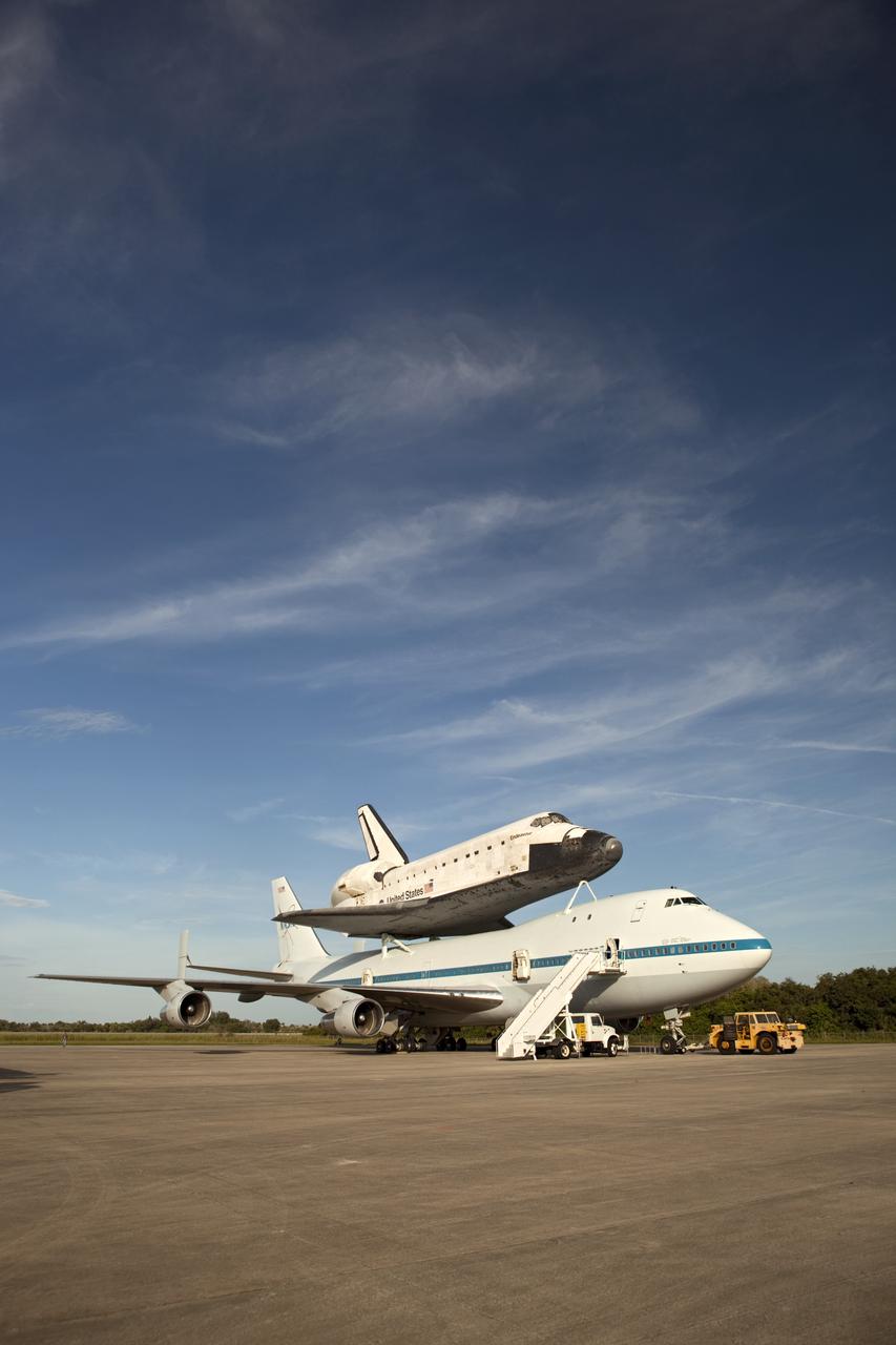 CAPE CANAVERAL, Fla. – NASA's Shuttle Carrier Aircraft, or SCA, is parked on the apron of the Shuttle Landing Facility at NASA's Kennedy Space Center in Florida with space shuttle Endeavour secured on its back. The SCA, a modified 747 jetliner, will fly Endeavour to Los Angeles where it will be placed on public display at the California Science Center. This is the final ferry flight scheduled in the Space Shuttle Program era. For more information on the shuttles' transition and retirement, visit http://www.nasa.gov/transition. Photo credit: NASA/Dimitri Gerondidakis