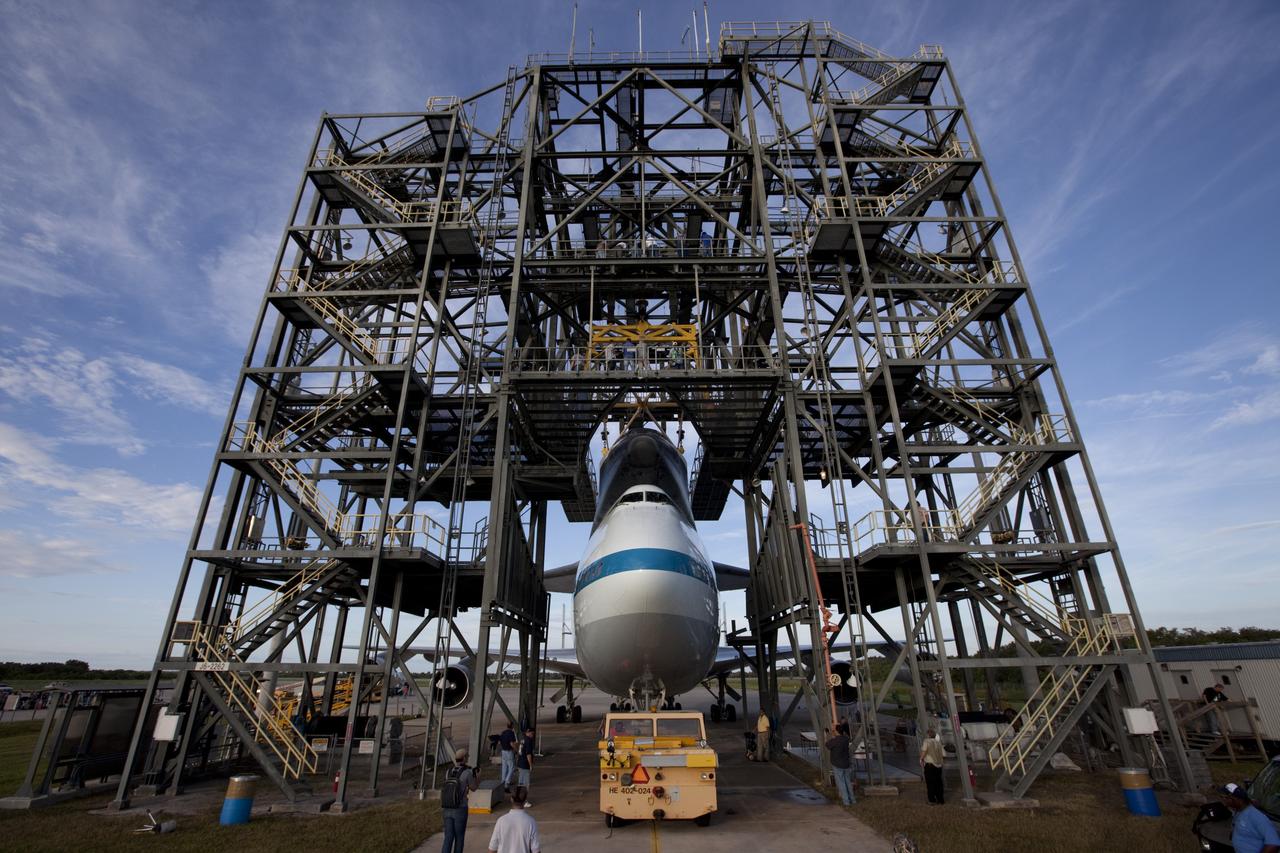 CAPE CANAVERAL, Fla. – At the Shuttle Landing Facility at NASA's Kennedy Space Center in Florida, the space shuttle Endeavour, mounted atop NASA's Shuttle Carrier Aircraft, or SCA, is rolled back from the mate-demate device.      The SCA, a modified 747 jetliner, will fly Endeavour to Los Angeles where it will be placed on public display at the California Science Center. This is the final ferry flight scheduled in the Space Shuttle Program era. For more information on the shuttles' transition and retirement, visit http://www.nasa.gov/transition.  Photo credit: NASA/ Kim Shiflett