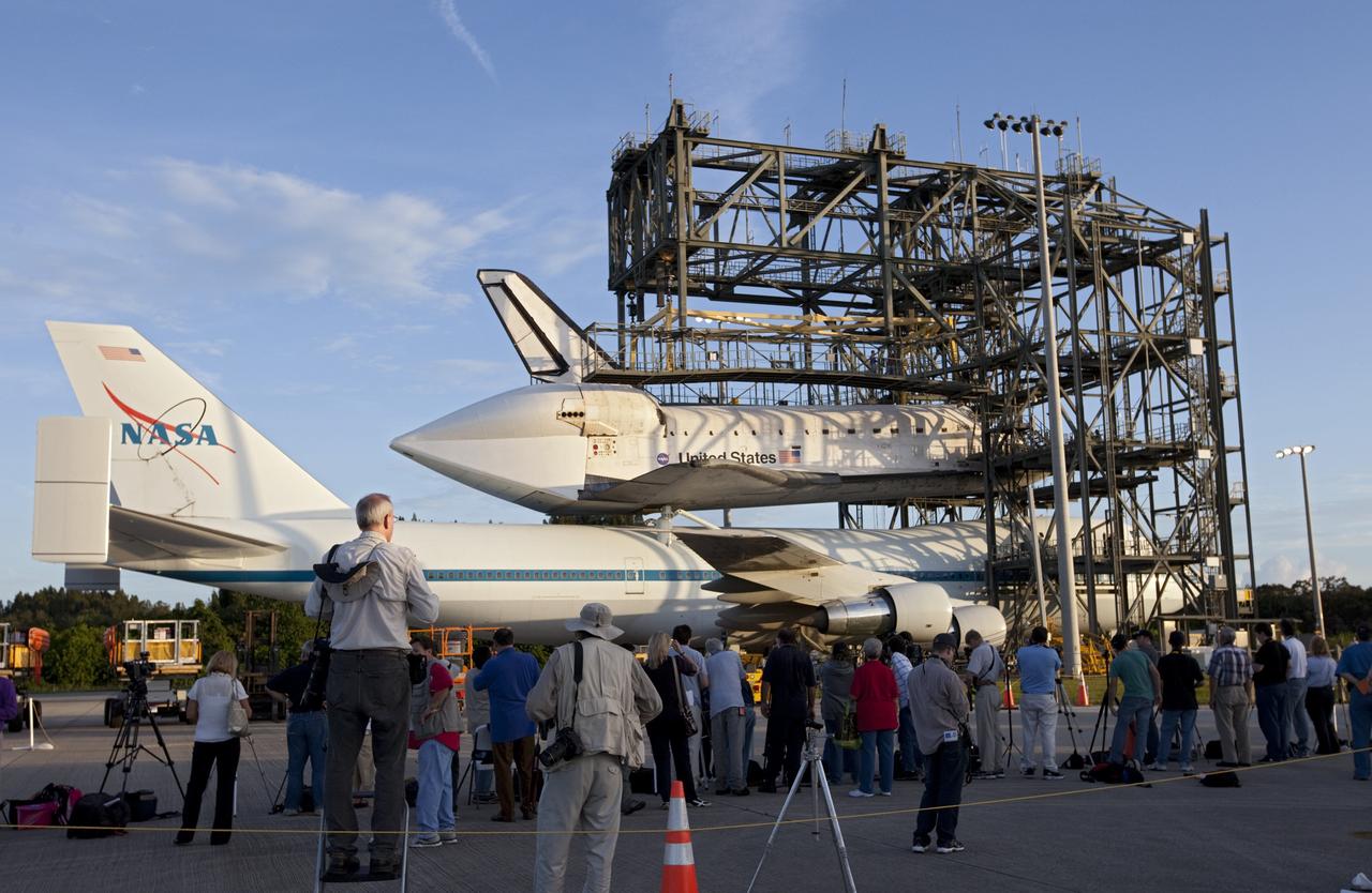 CAPE CANAVERAL, Fla. – At the Shuttle Landing Facility at NASA's Kennedy Space Center in Florida, members of the news media photograph the space shuttle Endeavour, mounted atop NASA's Shuttle Carrier Aircraft, or SCA, as it prepares to roll back from the mate-demate device.      The SCA, a modified 747 jetliner, will fly Endeavour to Los Angeles where it will be placed on public display at the California Science Center. This is the final ferry flight scheduled in the Space Shuttle Program era. For more information on the shuttles' transition and retirement, visit http://www.nasa.gov/transition.  Photo credit: NASA/ Kim Shiflett