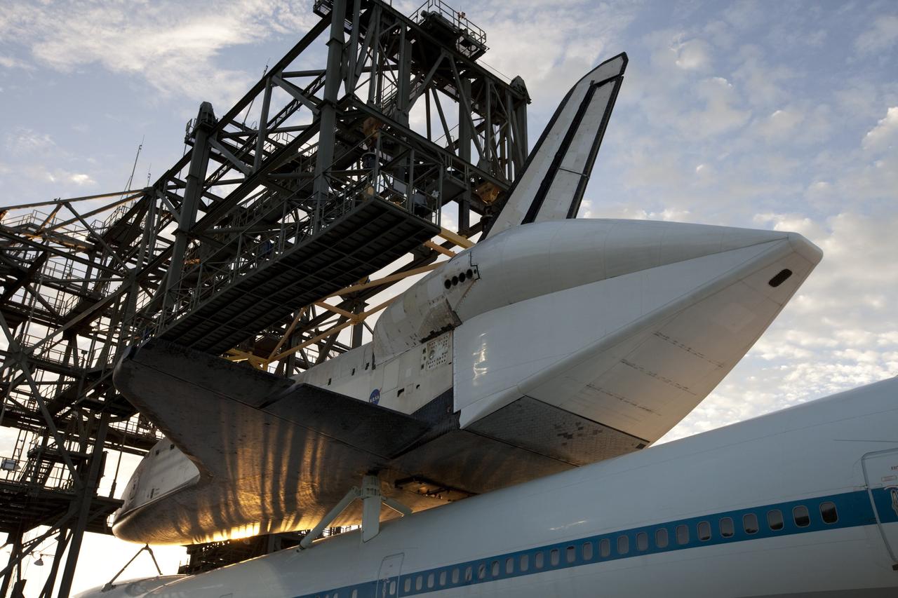 CAPE CANAVERAL, Fla. – At the Shuttle Landing Facility at NASA's Kennedy Space Center in Florida, rays from the early morning sun catch the space shuttle Endeavour, mounted atop NASA's Shuttle Carrier Aircraft, or SCA, as it is prepared to roll back from the mate-demate device.      The SCA, a modified 747 jetliner, will fly Endeavour to Los Angeles where it will be placed on public display at the California Science Center. This is the final ferry flight scheduled in the Space Shuttle Program era. For more information on the shuttles' transition and retirement, visit http://www.nasa.gov/transition.  Photo credit: NASA/ Kim Shiflett
