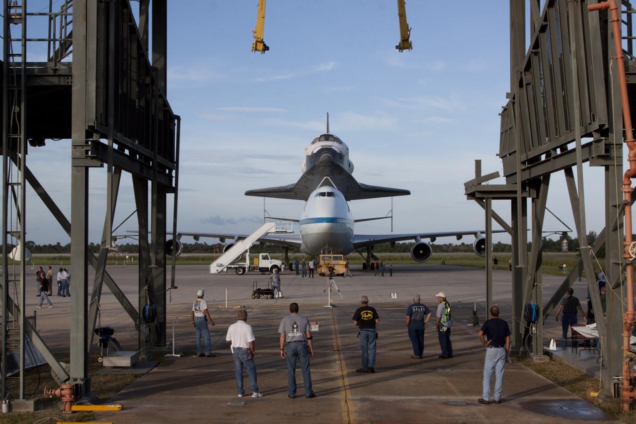 CAPE CANAVERAL, Fla. – Under the watchful eyes of United Space Alliance technicians, the space shuttle Endeavour, mounted atop NASA's Shuttle Carrier Aircraft, or SCA, has been rolled back from the mate-demate device at the Shuttle Landing Facility at NASA's Kennedy Space Center in Florida.      The SCA, a modified 747 jetliner, will fly Endeavour to Los Angeles where it will be placed on public display at the California Science Center. This is the final ferry flight scheduled in the Space Shuttle Program era. For more information on the shuttles' transition and retirement, visit http://www.nasa.gov/transition.  Photo credit: NASA/Kim Shiflett