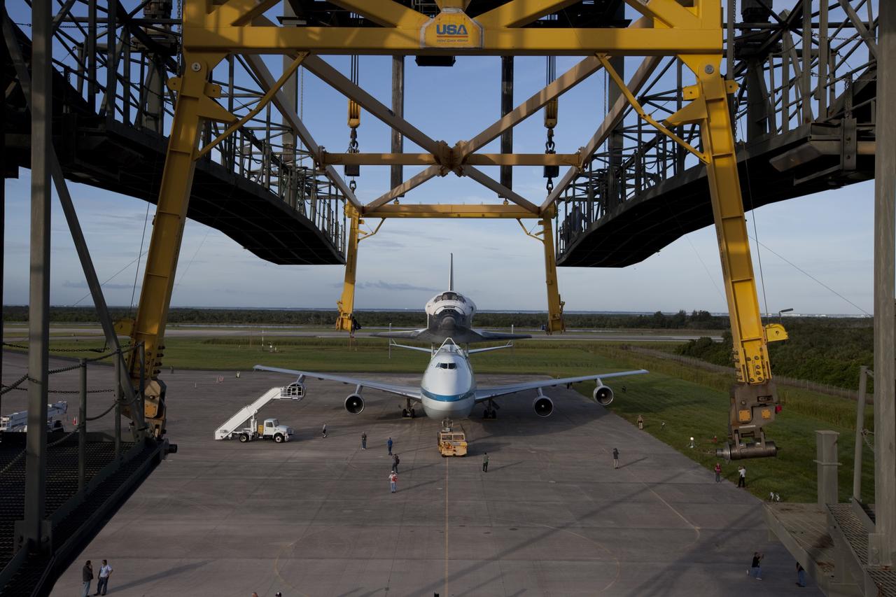 CAPE CANAVERAL, Fla. – Seen from the mate-demate device at the Shuttle Landing Facility at NASA's Kennedy Space Center in Florida, the space shuttle Endeavour, mounted atop NASA's Shuttle Carrier Aircraft, or SCA, has been rolled back in preparation for its ferry flight to California.      The SCA, a modified 747 jetliner, will fly Endeavour to Los Angeles where it will be placed on public display at the California Science Center. This is the final ferry flight scheduled in the Space Shuttle Program era. For more information on the shuttles' transition and retirement, visit http://www.nasa.gov/transition.  Photo credit: NASA/ Kim Shiflett