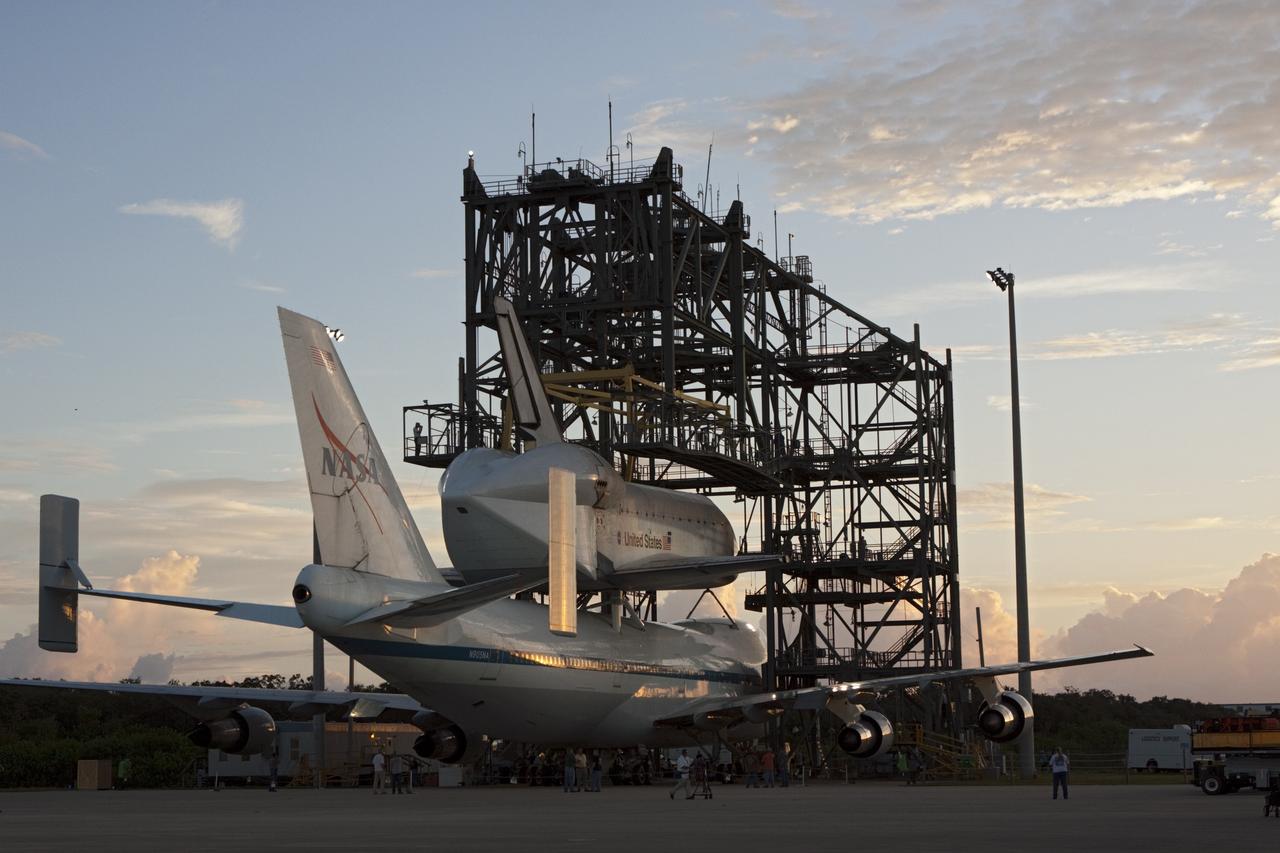 CAPE CANAVERAL, Fla. – At the Shuttle Landing Facility at NASA's Kennedy Space Center in Florida, rays from the early morning sun catch the space shuttle Endeavour, mounted atop NASA's Shuttle Carrier Aircraft, or SCA, as it prepared to roll back from the mate-demate device.      The SCA, a modified 747 jetliner, will fly Endeavour to Los Angeles where it will be placed on public display at the California Science Center. This is the final ferry flight scheduled in the Space Shuttle Program era. For more information on the shuttles' transition and retirement, visit http://www.nasa.gov/transition.  Photo credit: NASA/ Tim Jacobs