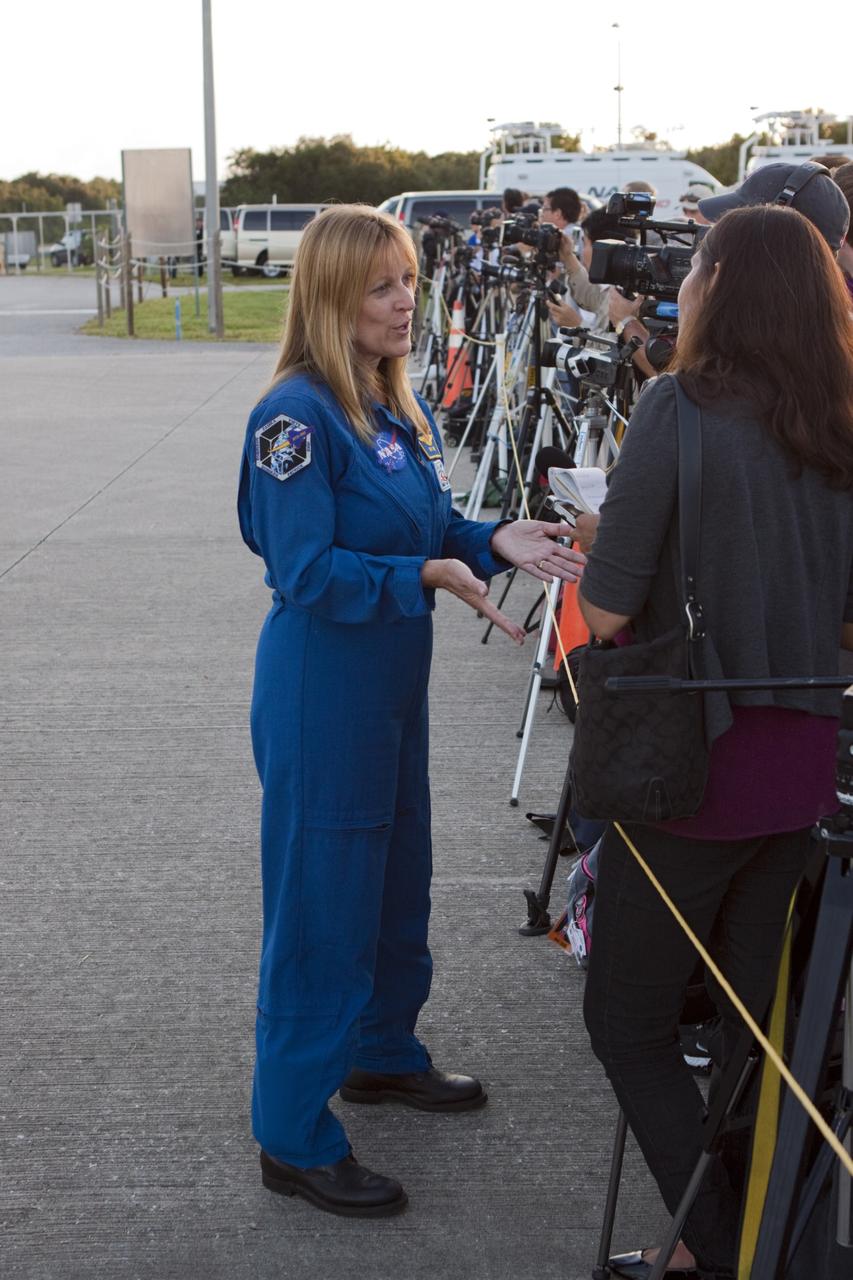 CAPE CANAVERAL, Fla. – NASA astronaut Kay Hire is interviewed by members of the news media at the Shuttle Landing Facility at NASA's Kennedy Space Center in Florida. Hire was on hand to discuss the space shuttle Endeavour's trip to California mounted atop NASA's Shuttle Carrier Aircraft, or SCA.      The SCA, a modified 747 jetliner, will fly Endeavour to Los Angeles where it will be placed on public display at the California Science Center. This is the final ferry flight scheduled in the Space Shuttle Program era. For more information on the shuttles' transition and retirement, visit http://www.nasa.gov/transition.  Photo credit: NASA/ Tim Jacobs