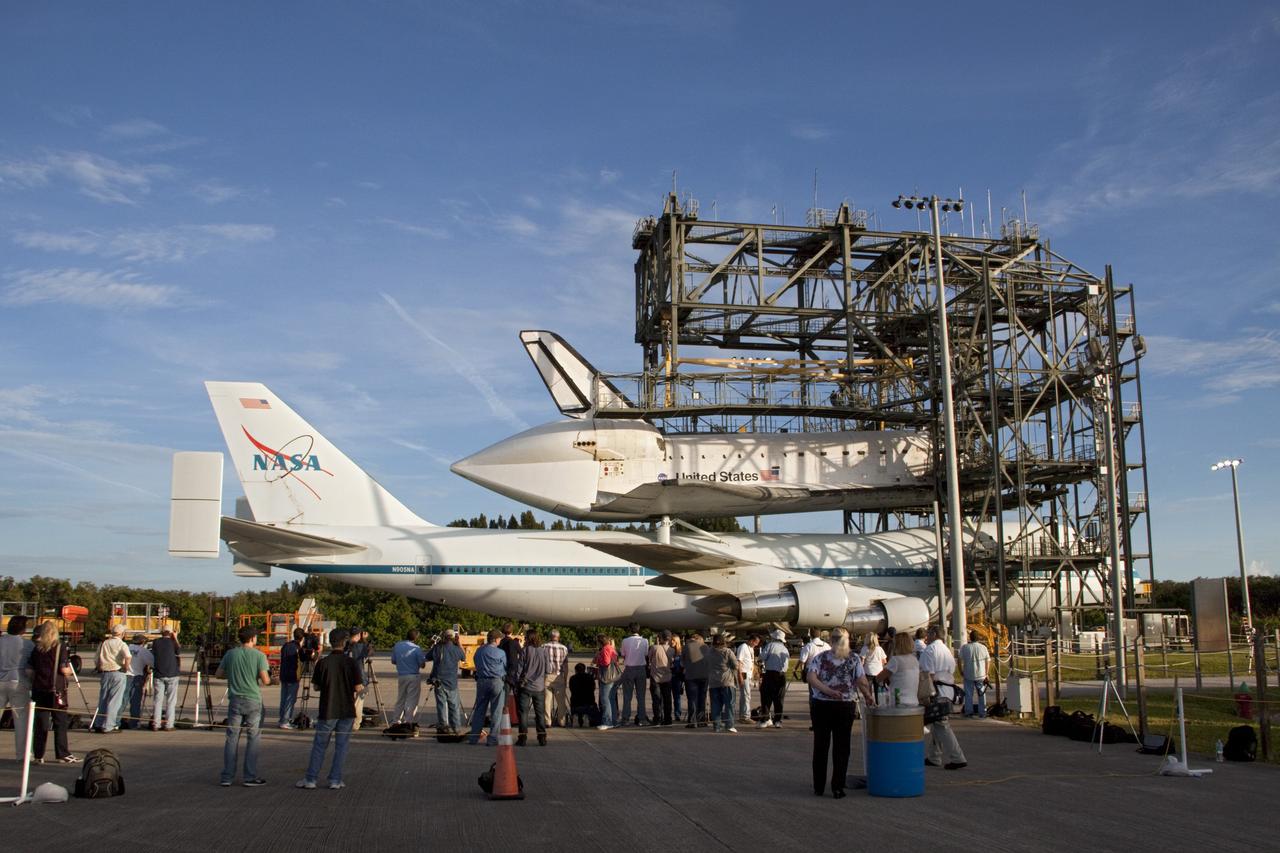 CAPE CANAVERAL, Fla. – At the Shuttle Landing Facility at NASA's Kennedy Space Center in Florida, members of the news media photograph the space shuttle Endeavour, mounted atop NASA's Shuttle Carrier Aircraft, or SCA, as it is prepared for roll back from the mate-demate device.      The SCA, a modified 747 jetliner, will fly Endeavour to Los Angeles where it will be placed on public display at the California Science Center. This is the final ferry flight scheduled in the Space Shuttle Program era. For more information on the shuttles' transition and retirement, visit http://www.nasa.gov/transition.  Photo credit: NASA/ Tim Jacobs