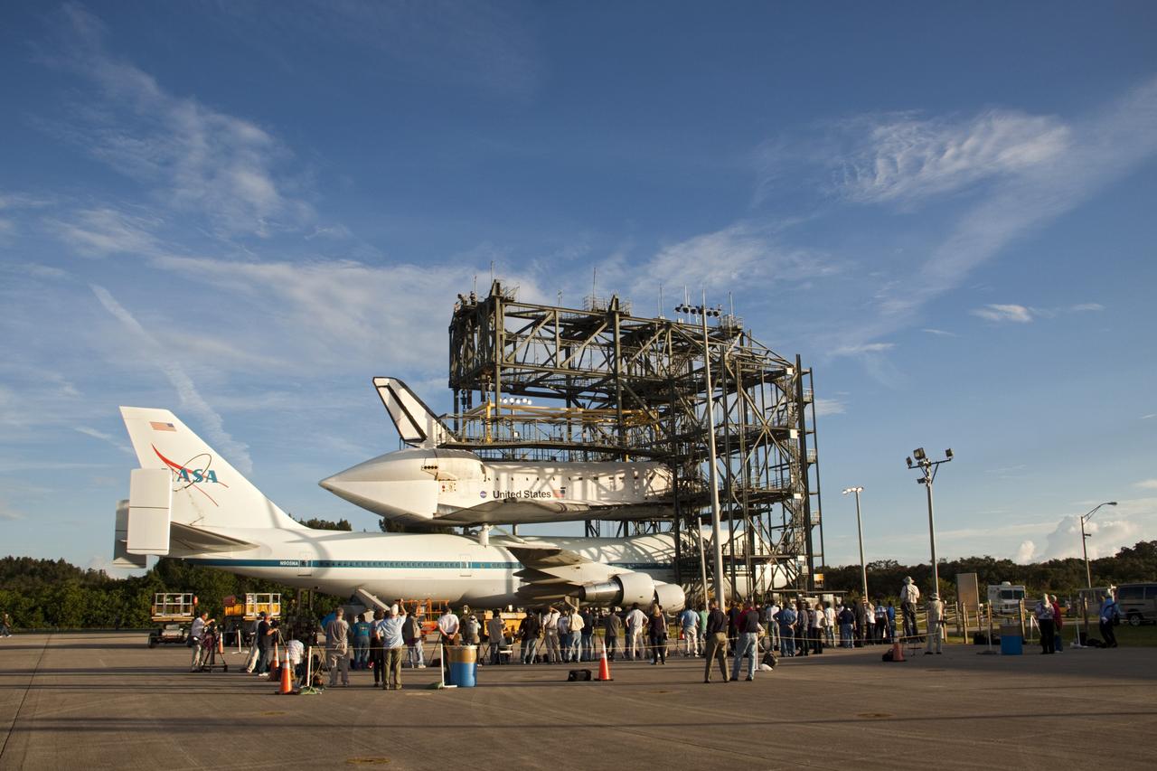CAPE CANAVERAL, Fla. – At the Shuttle Landing Facility at NASA's Kennedy Space Center in Florida, members of the news media photograph the space shuttle Endeavour, mounted atop NASA's Shuttle Carrier Aircraft, or SCA, as it is prepared for roll back from the mate-demate device.      The SCA, a modified 747 jetliner, will fly Endeavour to Los Angeles where it will be placed on public display at the California Science Center. This is the final ferry flight scheduled in the Space Shuttle Program era. For more information on the shuttles' transition and retirement, visit http://www.nasa.gov/transition.  Photo credit: NASA/ Tim Jacobs