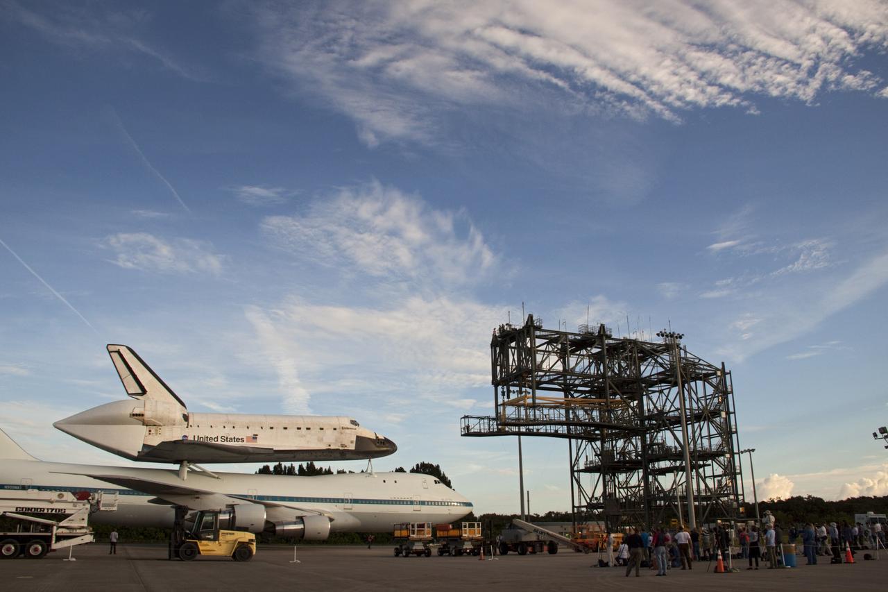 CAPE CANAVERAL, Fla. – At the Shuttle Landing Facility at NASA's Kennedy Space Center in Florida, members of the news media photograph the space shuttle Endeavour, mounted atop NASA's Shuttle Carrier Aircraft, or SCA, as it rolls back from the mate-demate device.      The SCA, a modified 747 jetliner, will fly Endeavour to Los Angeles where it will be placed on public display at the California Science Center. This is the final ferry flight scheduled in the Space Shuttle Program era. For more information on the shuttles' transition and retirement, visit http://www.nasa.gov/transition.  Photo credit: NASA/ Tim Jacobs