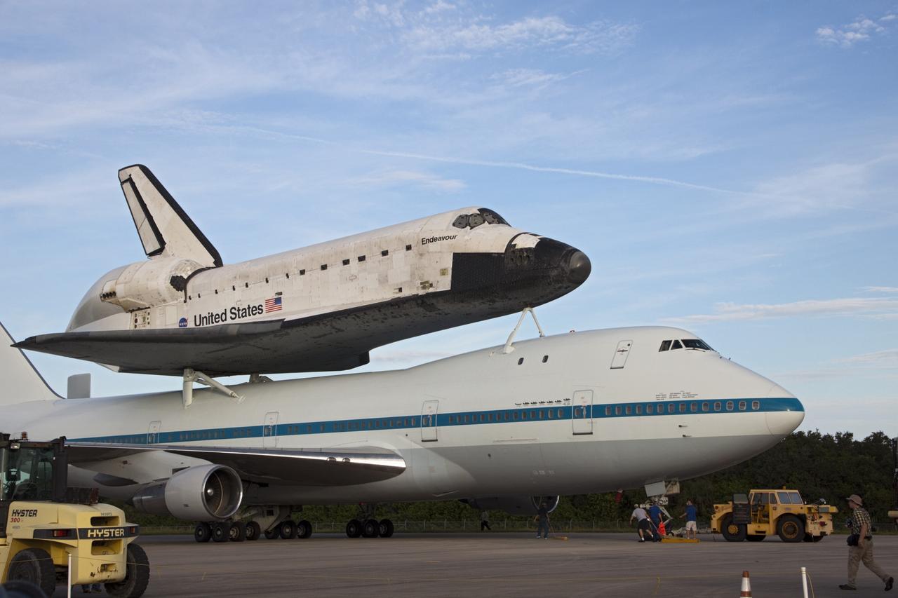 CAPE CANAVERAL, Fla. – At the Shuttle Landing Facility at NASA's Kennedy Space Center in Florida, the space shuttle Endeavour, mounted atop NASA's Shuttle Carrier Aircraft, or SCA, has rolled back from the mate-demate device in preparation for its ferry flight to California.      The SCA, a modified 747 jetliner, will fly Endeavour to Los Angeles where it will be placed on public display at the California Science Center. This is the final ferry flight scheduled in the Space Shuttle Program era. For more information on the shuttles' transition and retirement, visit http://www.nasa.gov/transition.  Photo credit: NASA/ Tim Jacobs