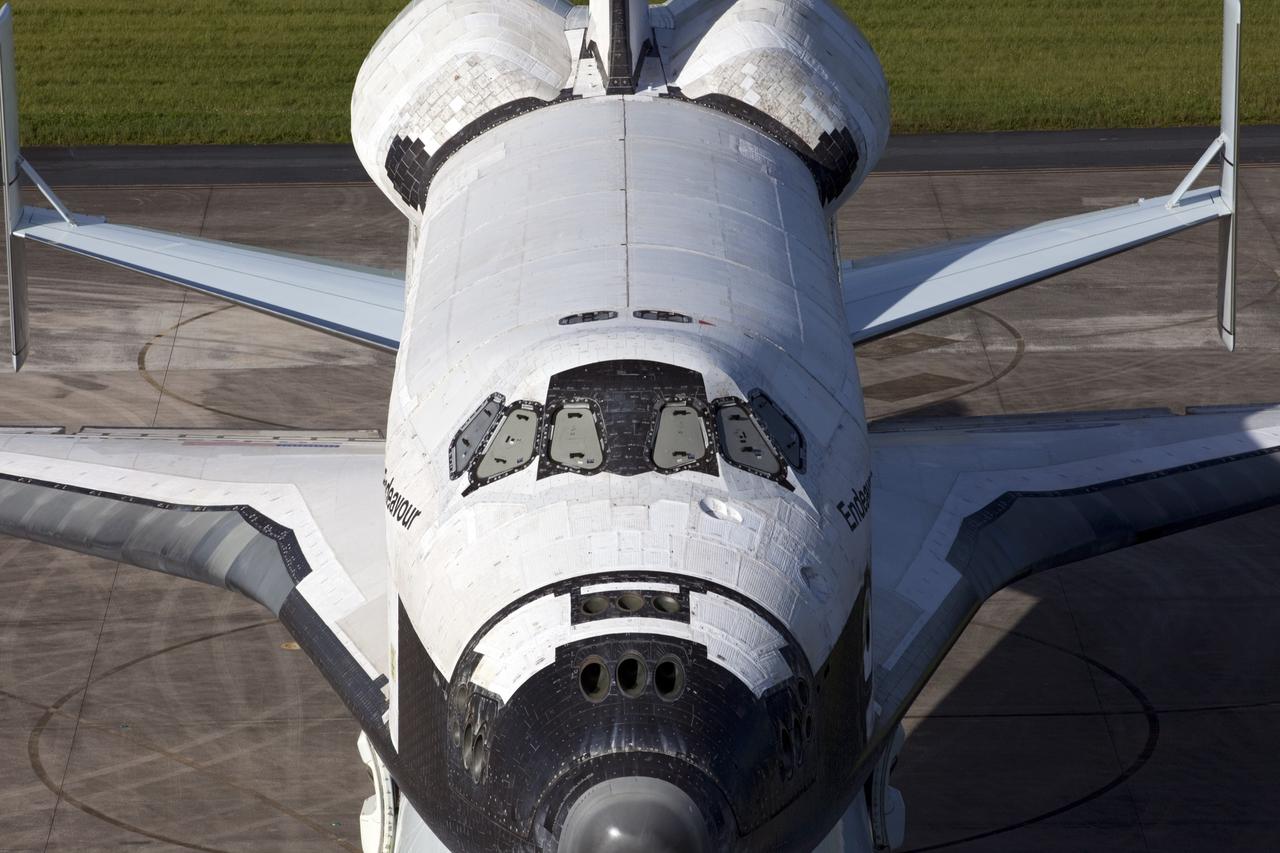 CAPE CANAVERAL, Fla. – Preparations are under way to uncover the cockpit windows on space shuttle Endeavour for an employee photo opportunity at the Shuttle Landing Facility at NASA's Kennedy Space Center in Florida.  Endeavour is balanced and secured atop NASA's Shuttle Carrier Aircraft, or SCA.    The SCA, a modified 747 jetliner, will fly Endeavour to Los Angeles where it will be placed on public display at the California Science Center. This is the final ferry flight scheduled in the Space Shuttle Program era. For more information on the shuttles' transition and retirement, visit http://www.nasa.gov/transition.  Photo credit: NASA/Kim Shiflett