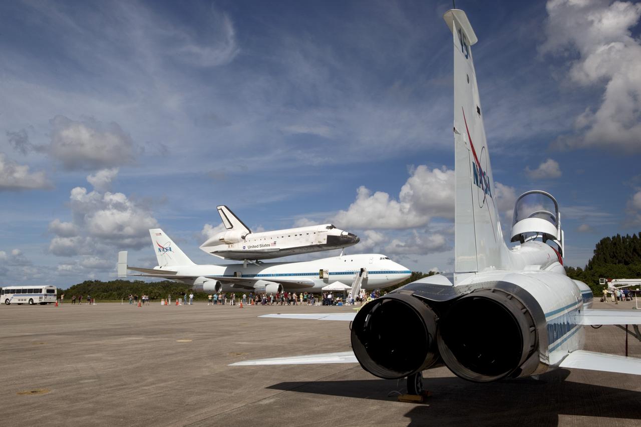 CAPE CANAVERAL, Fla. – At the Shuttle Landing Facility at NASA's Kennedy Space Center in Florida, the space shuttle Endeavour, mounted atop NASA's Shuttle Carrier Aircraft, or SCA, has rolled back from the mate-demate device in preparation for its ferry flight to California. In the foreground is a NASA T-38 jet.      The SCA, a modified 747 jetliner, will fly Endeavour to Los Angeles where it will be placed on public display at the California Science Center. This is the final ferry flight scheduled in the Space Shuttle Program era. For more information on the shuttles' transition and retirement, visit http://www.nasa.gov/transition.  Photo credit: NASA/ Dimitri Gerondidakis