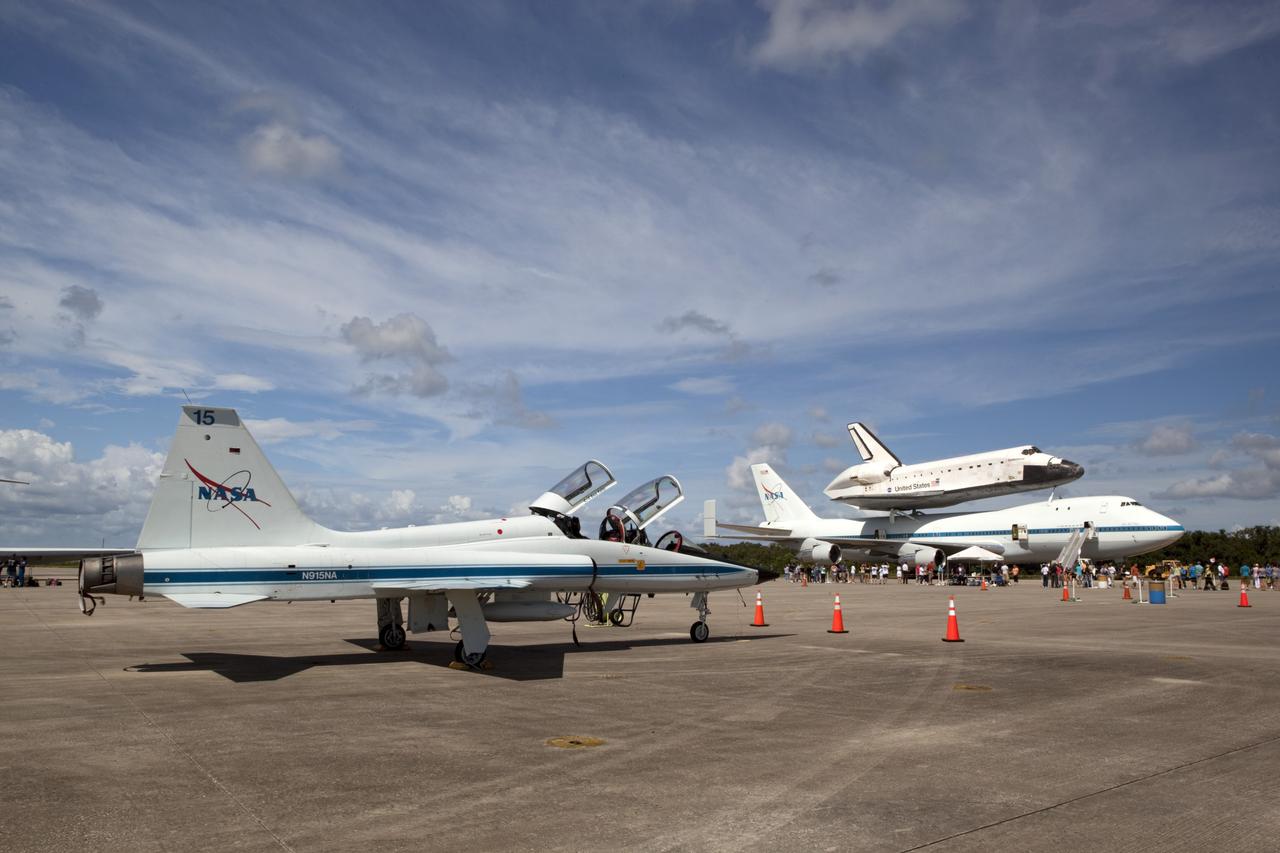 CAPE CANAVERAL, Fla. – At the Shuttle Landing Facility at NASA's Kennedy Space Center in Florida, the space shuttle Endeavour, mounted atop NASA's Shuttle Carrier Aircraft, or SCA, has rolled back from the mate-demate device in preparation for its ferry flight to California. In the foreground is a NASA T-38 jet.      The SCA, a modified 747 jetliner, will fly Endeavour to Los Angeles where it will be placed on public display at the California Science Center. This is the final ferry flight scheduled in the Space Shuttle Program era. For more information on the shuttles' transition and retirement, visit http://www.nasa.gov/transition.  Photo credit: NASA/ Dimitri Gerondidakis