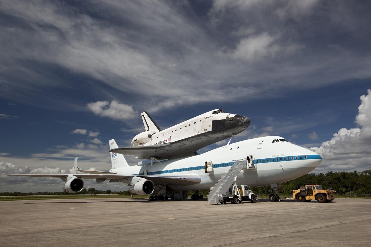 CAPE CANAVERAL, Fla. – At the Shuttle Landing Facility at NASA's Kennedy Space Center in Florida, the space shuttle Endeavour, mounted atop NASA's Shuttle Carrier Aircraft, or SCA, prepares for its ferry flight to California.      The SCA, a modified 747 jetliner, will fly Endeavour to Los Angeles where it will be placed on public display at the California Science Center. This is the final ferry flight scheduled in the Space Shuttle Program era. For more information on the shuttles' transition and retirement, visit http://www.nasa.gov/transition.  Photo credit: NASA/ Dimitri Gerondidakis