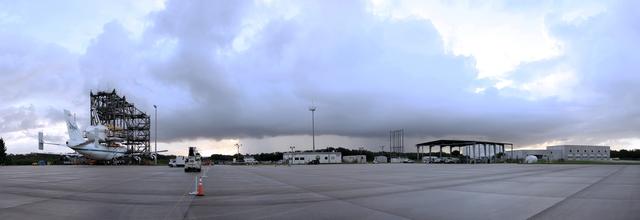 CAPE CANAVERAL, Fla. – This panoramic view at the Shuttle Landing Facility at NASA's Kennedy Space Center in Florida, shows the space shuttle Endeavour, mounted atop NASA's Shuttle Carrier Aircraft, or SCA, as it is being prepared for its ferry flight to California.      The SCA, a modified 747 jetliner, will fly Endeavour to Los Angeles where it will be placed on public display at the California Science Center. This is the final ferry flight scheduled in the Space Shuttle Program era. For more information on the shuttles' transition and retirement, visit http://www.nasa.gov/transition.  Photo credit: NASA/ Frankie Martin