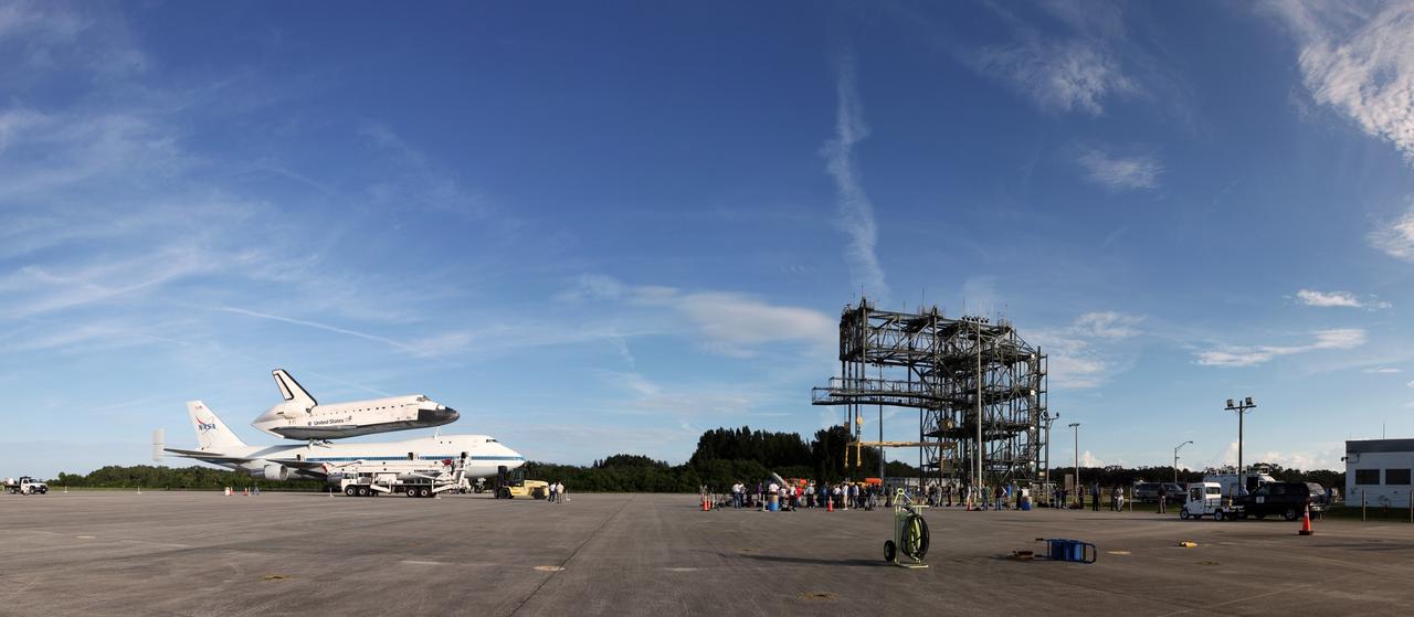 CAPE CANAVERAL, Fla. – This panoramic view at the Shuttle Landing Facility at NASA's Kennedy Space Center in Florida, shows the space shuttle Endeavour, mounted atop NASA's Shuttle Carrier Aircraft, or SCA, as it is being prepared for its ferry flight to California.      The SCA, a modified 747 jetliner, will fly Endeavour to Los Angeles where it will be placed on public display at the California Science Center. This is the final ferry flight scheduled in the Space Shuttle Program era. For more information on the shuttles' transition and retirement, visit http://www.nasa.gov/transition.  Photo credit: NASA/ Frankie Martin