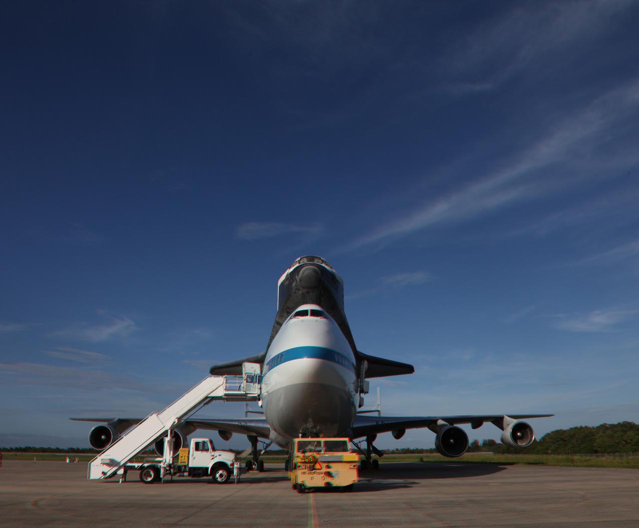 CAPE CANAVERAL, Fla. – This three-dimensional view at the Shuttle Landing Facility at NASA's Kennedy Space Center in Florida, shows the space shuttle Endeavour, mounted atop NASA's Shuttle Carrier Aircraft, or SCA, as it is being prepared for its ferry flight to California.   This image may be viewed in 3-D with red and blue glasses.    The SCA, a modified 747 jetliner, will fly Endeavour to Los Angeles where it will be placed on public display at the California Science Center. This is the final ferry flight scheduled in the Space Shuttle Program era. For more information on the shuttles' transition and retirement, visit http://www.nasa.gov/transition.  Photo credit: NASA/ Frankie Martin
