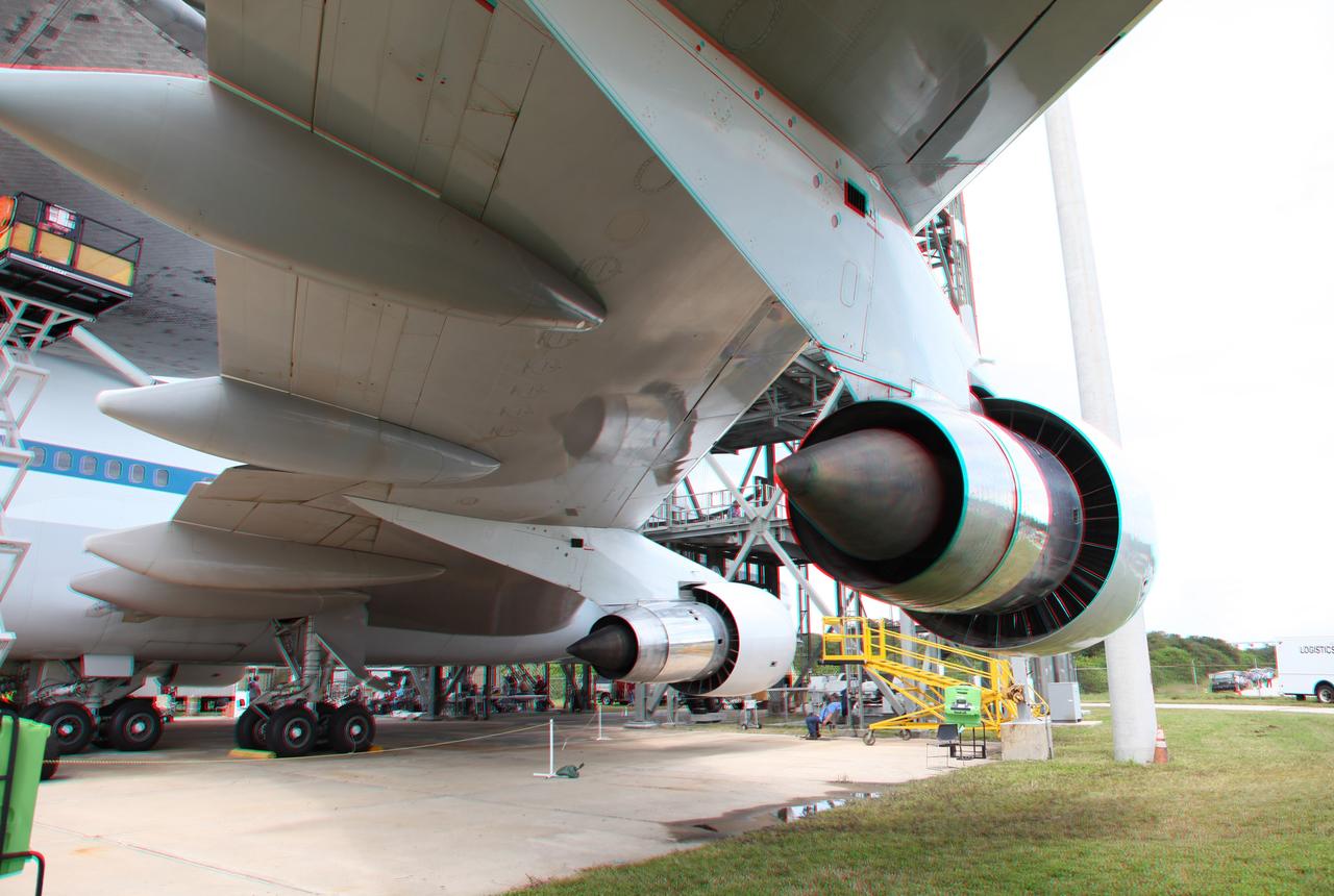 CAPE CANAVERAL, Fla. – This three -dimensional view at the Shuttle Landing Facility at NASA's Kennedy Space Center in Florida, shows jet engines under a wing of the NASA Shuttle Carrier Aircraft, or SCA, which will ferry the space shuttle Endeavour for its ferry flight to California.  This image may be viewed in 3-D with red and blue glasses.      The SCA, a modified 747 jetliner, will fly Endeavour to Los Angeles where it will be placed on public display at the California Science Center. This is the final ferry flight scheduled in the Space Shuttle Program era. For more information on the shuttles' transition and retirement, visit http://www.nasa.gov/transition.  Photo credit: NASA/ Frankie Martin