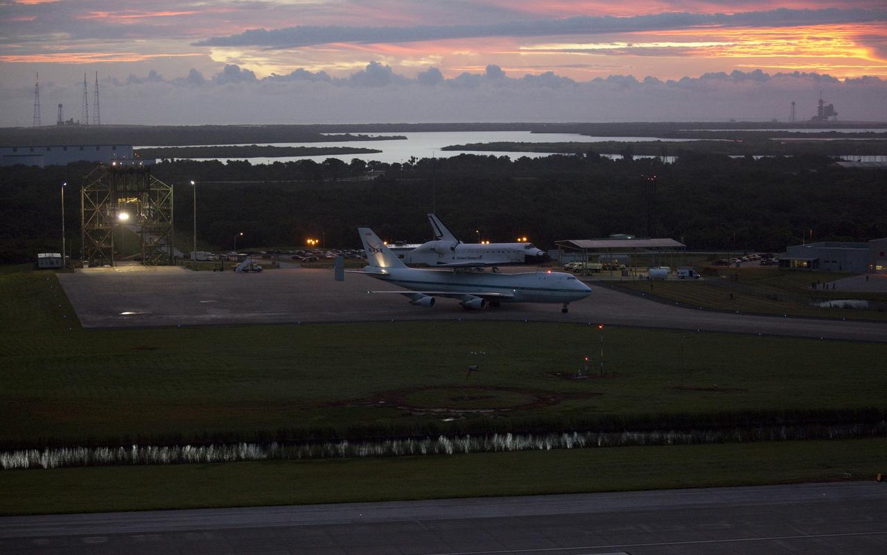CAPE CANAVERAL, Fla. – At the Shuttle Landing Facility at NASA's Kennedy Space Center in Florida, NASA's Shuttle Carrier Aircraft, or SCA, with the space shuttle Endeavour mounted atop, taxis away from the mate-demate device for its ferry flight to California.    The SCA, a modified 747 jetliner, will fly Endeavour to Los Angeles where it will be placed on public display at the California Science Center. This is the final ferry flight scheduled in the Space Shuttle Program era. For more information on the shuttles' transition and retirement, visit http://www.nasa.gov/transition.  Photo credit: NASA/Kim Shiflett