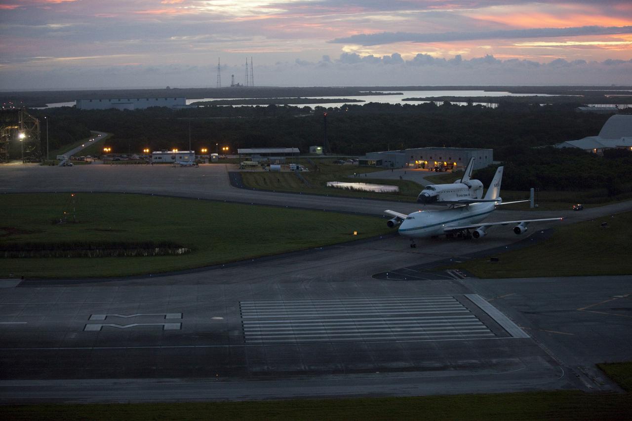 CAPE CANAVERAL, Fla. – At the Shuttle Landing Facility at NASA's Kennedy Space Center in Florida, NASA's Shuttle Carrier Aircraft, or SCA, with the space shuttle Endeavour mounted atop, taxis away from the mate-demate device for its ferry flight to California.    The SCA, a modified 747 jetliner, will fly Endeavour to Los Angeles where it will be placed on public display at the California Science Center. This is the final ferry flight scheduled in the Space Shuttle Program era. For more information on the shuttles' transition and retirement, visit http://www.nasa.gov/transition.  Photo credit: NASA/Kim Shiflett