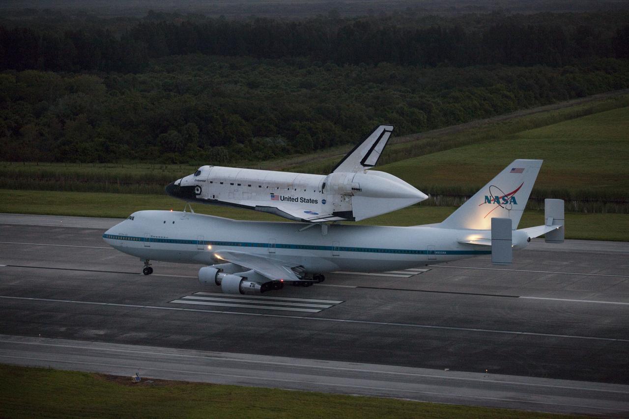 CAPE CANAVERAL, Fla. – At the Shuttle Landing Facility at NASA's Kennedy Space Center in Florida, NASA's Shuttle Carrier Aircraft, or SCA, with the space shuttle Endeavour mounted atop, taxis down the runway for its ferry flight to California.    The SCA, a modified 747 jetliner, will fly Endeavour to Los Angeles where it will be placed on public display at the California Science Center. This is the final ferry flight scheduled in the Space Shuttle Program era. For more information on the shuttles' transition and retirement, visit http://www.nasa.gov/transition.  Photo credit: NASA/Kim Shiflett