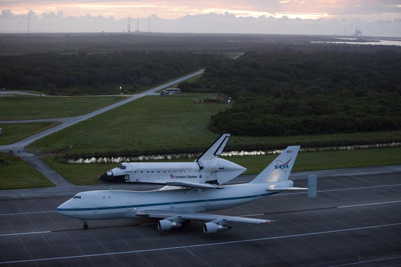 CAPE CANAVERAL, Fla. – At the Shuttle Landing Facility at NASA's Kennedy Space Center in Florida, NASA's Shuttle Carrier Aircraft, or SCA, with the space shuttle Endeavour mounted atop, taxis down the runway for its ferry flight to California.    The SCA, a modified 747 jetliner, will fly Endeavour to Los Angeles where it will be placed on public display at the California Science Center. This is the final ferry flight scheduled in the Space Shuttle Program era. For more information on the shuttles' transition and retirement, visit http://www.nasa.gov/transition.  Photo credit: NASA/Kim Shiflett