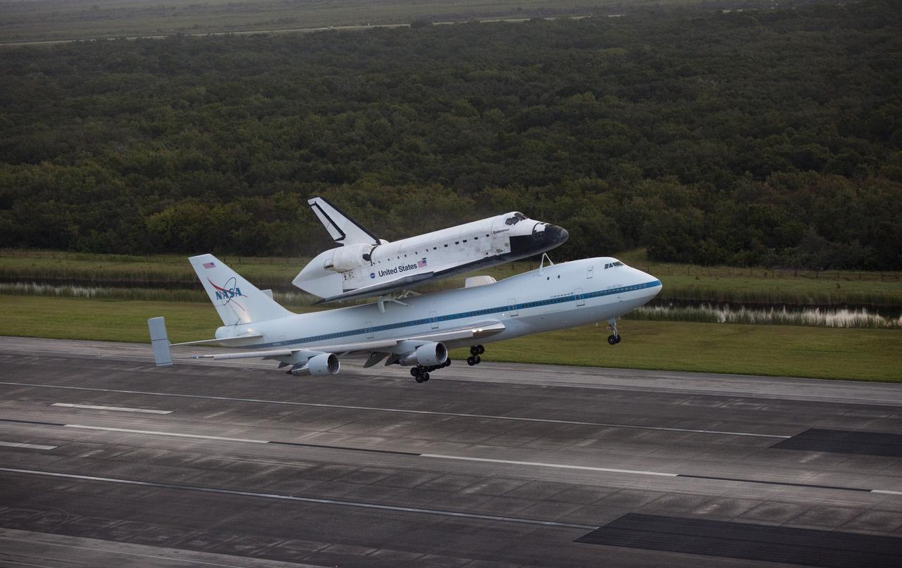 CAPE CANAVERAL, Fla. – Space shuttle Endeavour lifts off from the Shuttle Landing Facility runway at NASA's Kennedy Space Center in Florida at 7:22 a.m. EDT mounted atop NASA's Shuttle Carrier Aircraft, or SCA. The SCA, a modified 747 jetliner, will fly Endeavour to Houston and then to Los Angeles where it will be placed on public display at the California Science Center. This is the final ferry flight scheduled in the Space Shuttle Program era. For more information on the shuttles' transition and retirement, visit http://www.nasa.gov/transition. Photo credit: NASA/Kim Shiflett
