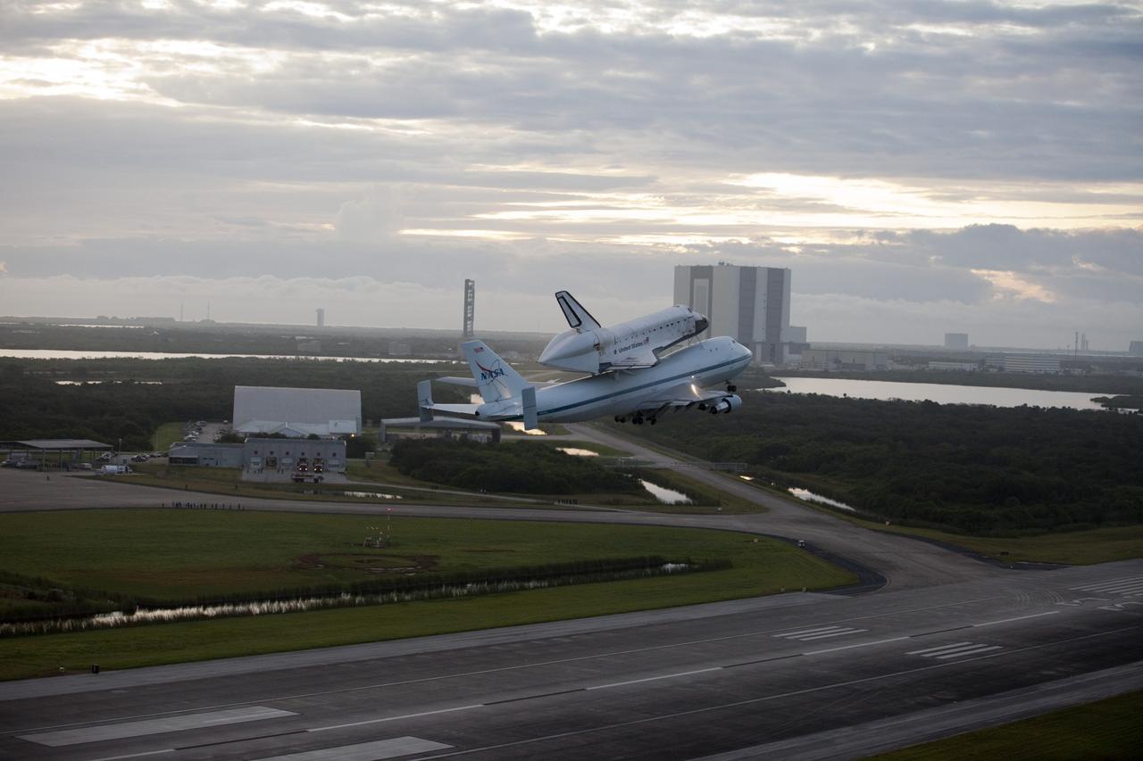 CAPE CANAVERAL, Fla. – Space shuttle Endeavour takes to the sky from the Shuttle Landing Facility at NASA's Kennedy Space Center in Florida at 7:22 a.m. EDT mounted atop NASA's Shuttle Carrier Aircraft, or SCA. In the background is the 525-foot-tall Vehicle Assembly Building where the shuttles were attached to their external fuel tank/solid rocket booster stacks. The SCA, a modified 747 jetliner, will fly Endeavour to Houston and then to Los Angeles where it will be placed on public display at the California Science Center. This is the final ferry flight scheduled in the Space Shuttle Program era. For more information on the shuttles' transition and retirement, visit http://www.nasa.gov/transition. Photo credit: NASA/Kim Shiflett