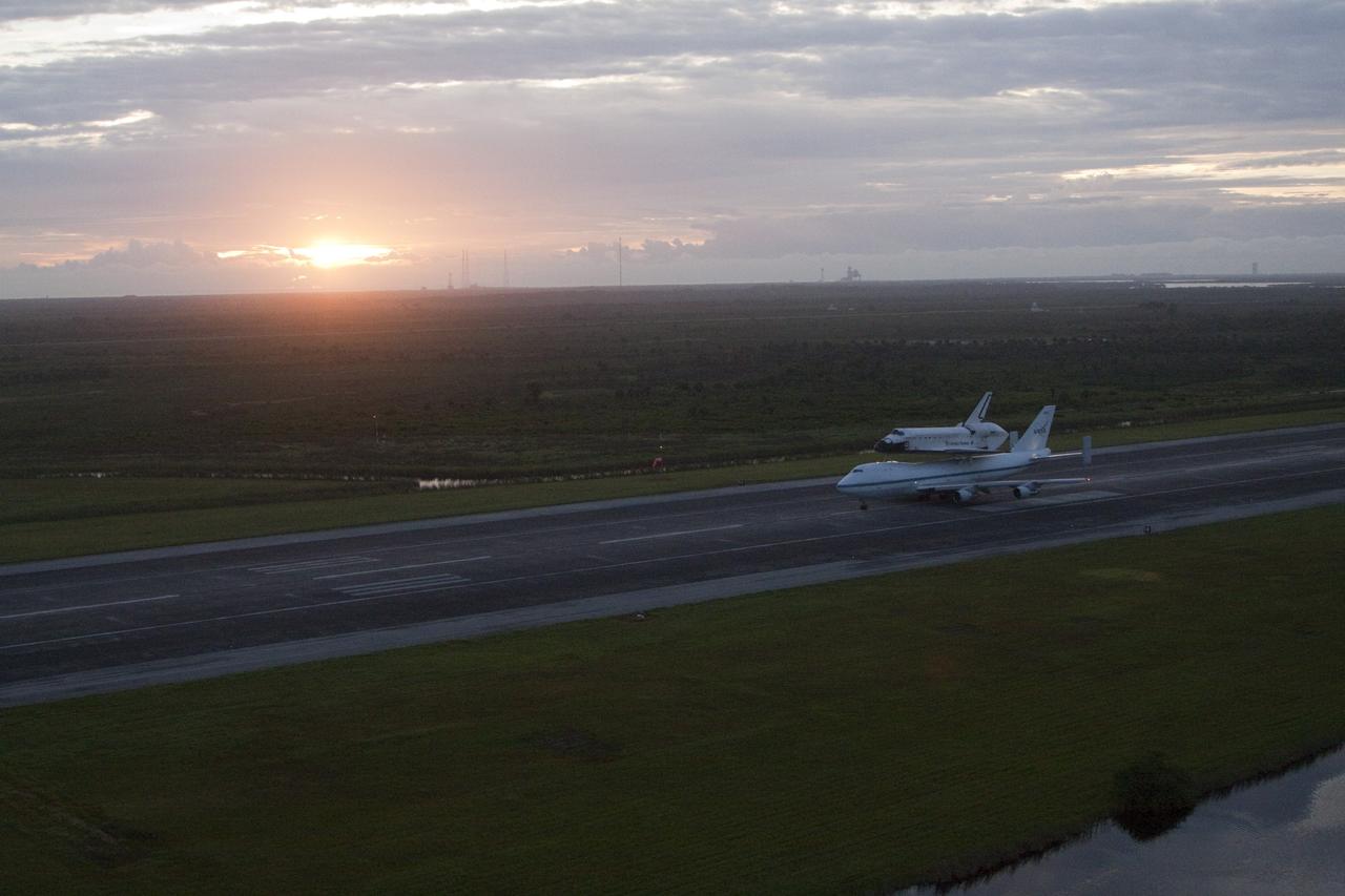 CAPE CANAVERAL, Fla. – As the sun rises over NASA's Kennedy Space Center in Florida, Space shuttle Endeavour takes off from the Shuttle Landing Facility at 7:22 a.m. EDT mounted atop NASA's Shuttle Carrier Aircraft, or SCA.    The SCA, a modified 747 jetliner, will fly Endeavour to Los Angeles where it will be placed on public display at the California Science Center. This is the final ferry flight scheduled in the Space Shuttle Program era. For more information on the shuttles' transition and retirement, visit http://www.nasa.gov/transition.  Photo credit: NASA/Kim Shiflett