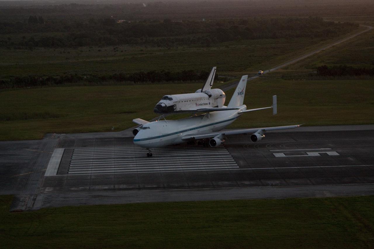 CAPE CANAVERAL, Fla. – NASA's Shuttle Carrier Aircraft, or SCA, rolls into position on the runway at the Shuttle Landing at NASA's Kennedy Space Center in Florida with space shuttle Endeavour piggyback. Takeoff came at 7:22 a.m. EDT.    The SCA, a modified 747 jetliner, will fly Endeavour to Los Angeles where it will be placed on public display at the California Science Center. This is the final ferry flight scheduled in the Space Shuttle Program era. For more information on the shuttles' transition and retirement, visit http://www.nasa.gov/transition.  Photo credit: NASA/Kim Shiflett