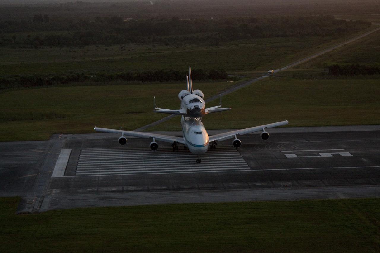 CAPE CANAVERAL, Fla. – NASA's Shuttle Carrier Aircraft, or SCA, turns into position on the runway at the Shuttle Landing at NASA's Kennedy Space Center in Florida with space shuttle Endeavour piggyback. Takeoff came at 7:22 a.m. EDT.    The SCA, a modified 747 jetliner, will fly Endeavour to Los Angeles where it will be placed on public display at the California Science Center. This is the final ferry flight scheduled in the Space Shuttle Program era. For more information on the shuttles' transition and retirement, visit http://www.nasa.gov/transition.  Photo credit: NASA/Kim Shiflett