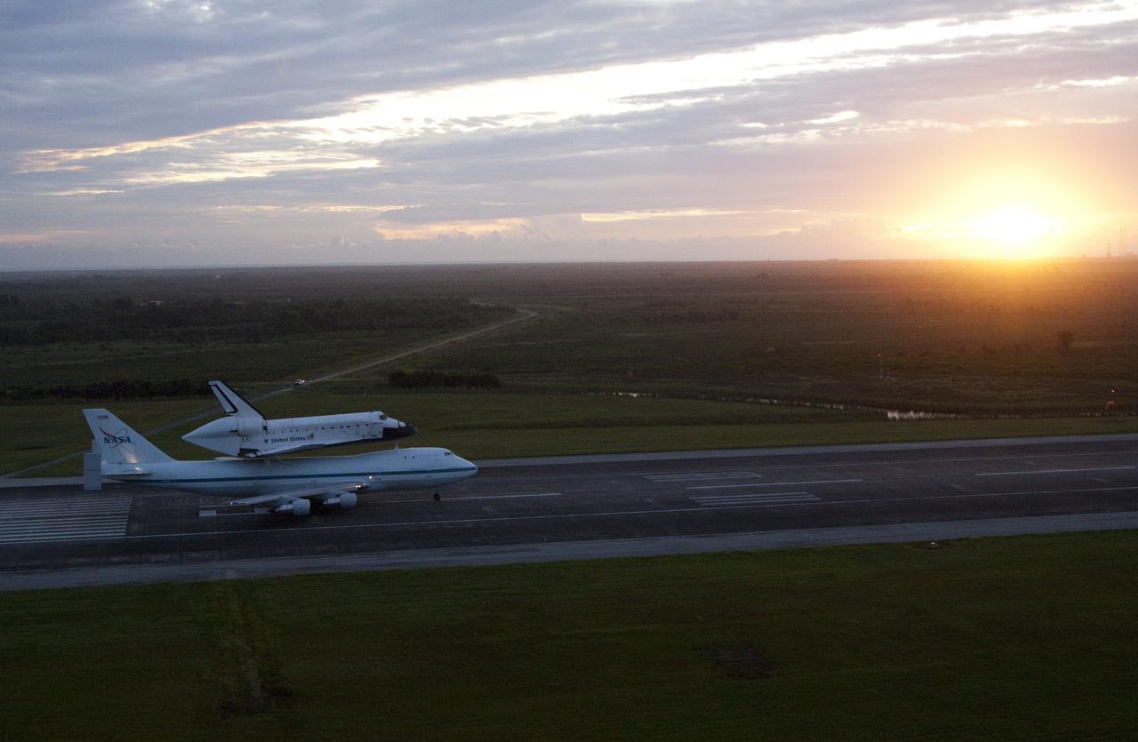CAPE CANAVERAL, Fla. – NASA's Shuttle Carrier Aircraft, or SCA, glides down the runway at the Shuttle Landing at NASA's Kennedy Space Center in Florida with space shuttle Endeavour secured on top. Takeoff came at 7:22 a.m. EDT. The SCA, a modified 747 jetliner, will fly Endeavour to Los Angeles where it will be placed on public display at the California Science Center. This is the final ferry flight scheduled in the Space Shuttle Program era. For more information on the shuttles' transition and retirement, visit http://www.nasa.gov/transition. Photo credit: NASA/Kim Shiflett
