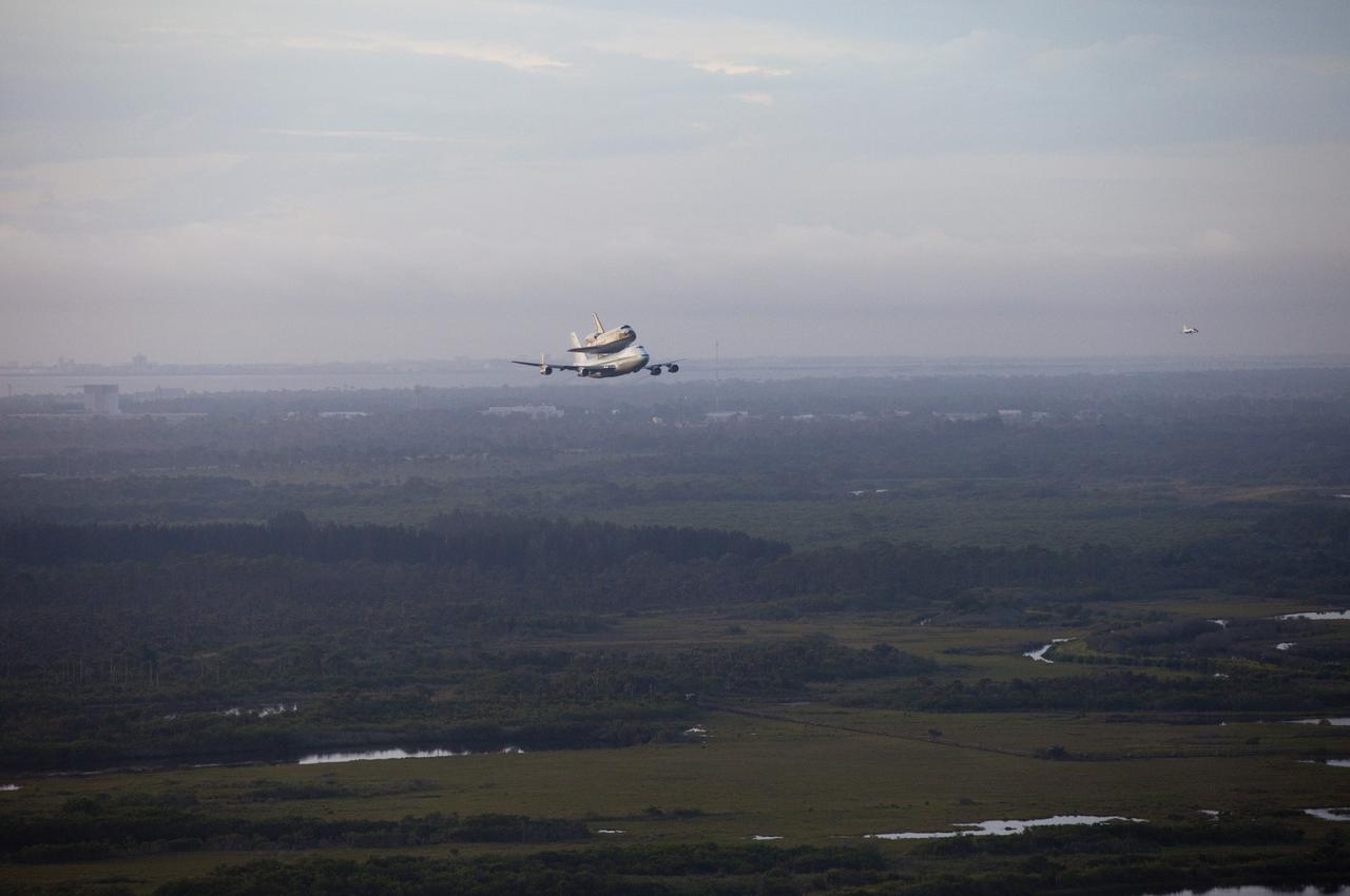 CAPE CANAVERAL, Fla. – Weather cooperating on the third attempt, space shuttle Endeavour takes off from the Shuttle Landing Facility runway at NASA's Kennedy Space Center in Florida at 7:22 a.m. EDT mounted atop NASA's Shuttle Carrier Aircraft, or SCA.    The SCA, a modified 747 jetliner, will fly Endeavour to Los Angeles where it will be placed on public display at the California Science Center. This is the final ferry flight scheduled in the Space Shuttle Program era. For more information on the shuttles' transition and retirement, visit http://www.nasa.gov/transition.  Photo credit: NASA/Kim Shiflett