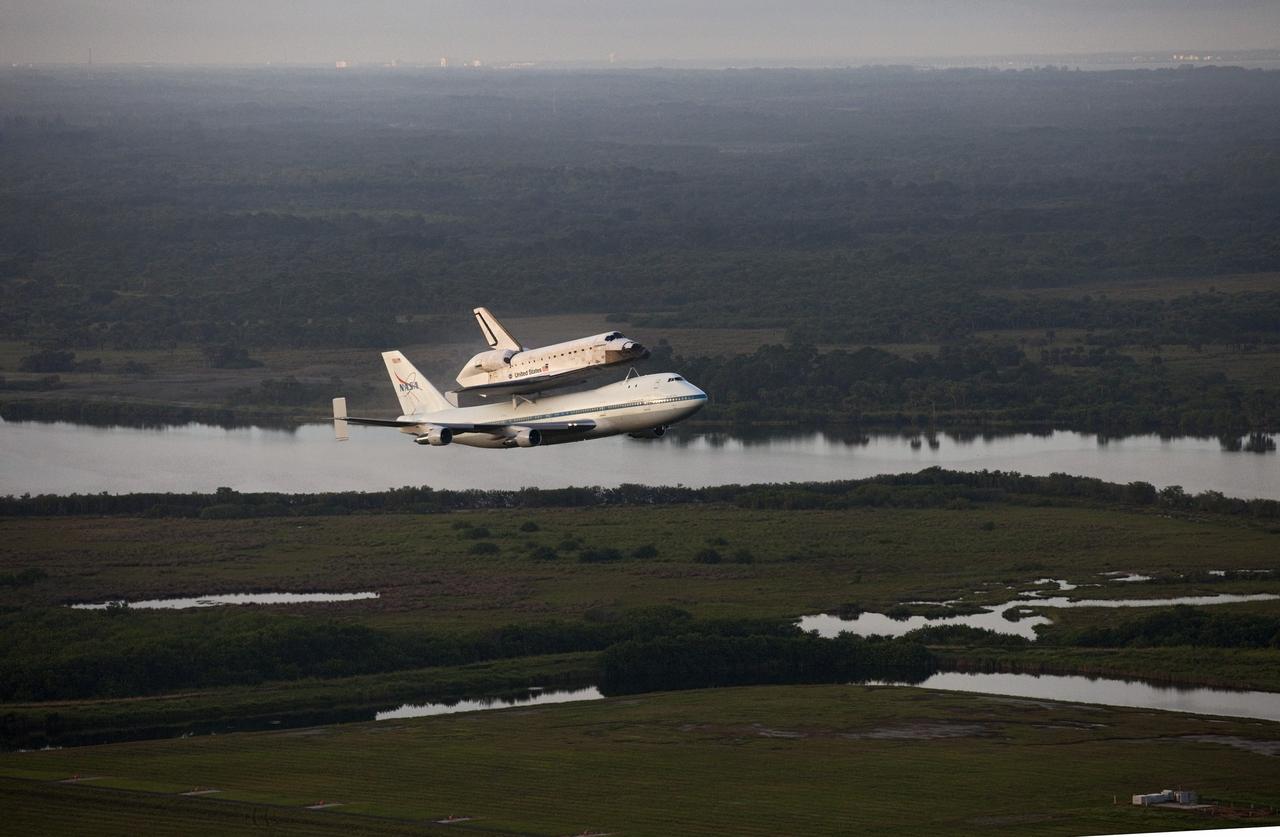 CAPE CANAVERAL, Fla. – Space shuttle Endeavour, mounted atop NASA's Shuttle Carrier Aircraft or SCA, soars away from the Shuttle Landing Facility at NASA's Kennedy Space Center in Florida at 7:22 a.m. EDT.     The SCA, a modified 747 jetliner, will fly Endeavour to Los Angeles where it will be placed on public display at the California Science Center. This is the final ferry flight scheduled in the Space Shuttle Program era. For more information on the shuttles' transition and retirement, visit http://www.nasa.gov/transition.  Photo credit: NASA/Kim Shiflett