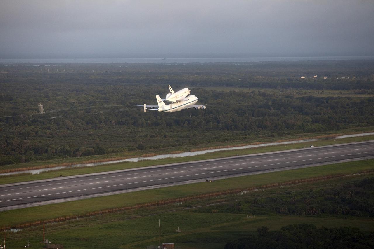CAPE CANAVERAL, Fla. – Space shuttle Endeavour, mounted atop NASA's Shuttle Carrier Aircraft or SCA, rises above the runway at the Shuttle Landing Facility at NASA's Kennedy Space Center in Florida at 7:22 a.m. EDT.     The SCA, a modified 747 jetliner, will fly Endeavour to Los Angeles where it will be placed on public display at the California Science Center. This is the final ferry flight scheduled in the Space Shuttle Program era. For more information on the shuttles' transition and retirement, visit http://www.nasa.gov/transition.  Photo credit: NASA/Kim Shiflett