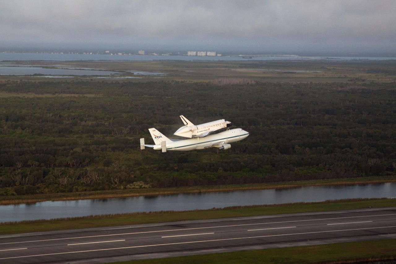 CAPE CANAVERAL, Fla. – Space shuttle Endeavour, mounted atop NASA's Shuttle Carrier Aircraft or SCA, is airborne at 7:22 a.m. EDT from the Shuttle Landing Facility at NASA's Kennedy Space Center in Florida. The SCA, a modified 747 jetliner, will fly Endeavour to Los Angeles where it will be placed on public display at the California Science Center. This is the final ferry flight scheduled in the Space Shuttle Program era. For more information on the shuttles' transition and retirement, visit http://www.nasa.gov/transition. Photo credit: NASA/Kim Shiflett