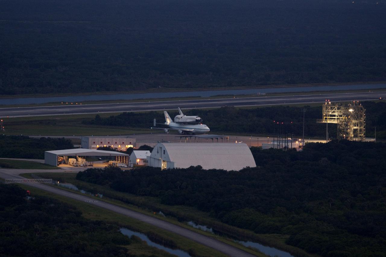 CAPE CANAVERAL, Fla. – At the Shuttle Landing Facility at NASA's Kennedy Space Center in Florida, NASA's Shuttle Carrier Aircraft, or SCA, with the space shuttle Endeavour mounted atop, prepares to taxi to the runway for its ferry flight to California.    The SCA, a modified 747 jetliner, will fly Endeavour to Los Angeles where it will be placed on public display at the California Science Center. This is the final ferry flight scheduled in the Space Shuttle Program era. For more information on the shuttles' transition and retirement, visit http://www.nasa.gov/transition.  Photo credit: NASA/Jim Grossmann