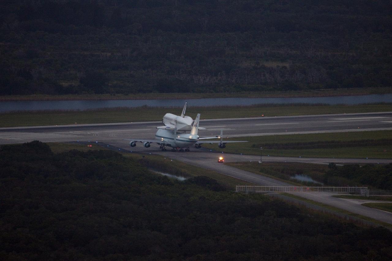 CAPE CANAVERAL, Fla. – At the Shuttle Landing Facility at NASA's Kennedy Space Center in Florida, NASA's Shuttle Carrier Aircraft, or SCA, with the space shuttle Endeavour mounted atop, taxis to the runway for its ferry flight to California. The SCA, a modified 747 jetliner, will fly Endeavour to Los Angeles where it will be placed on public display at the California Science Center. This is the final ferry flight scheduled in the Space Shuttle Program era. For more information on the shuttles' transition and retirement, visit http://www.nasa.gov/transition. Photo credit: NASA/Jim Grossmann