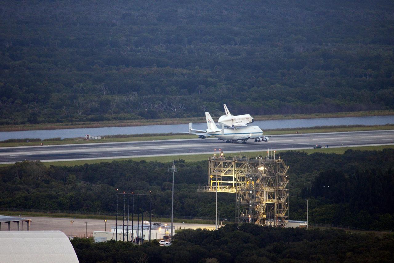 CAPE CANAVERAL, Fla. – At the Shuttle Landing Facility at NASA's Kennedy Space Center in Florida, NASA's Shuttle Carrier Aircraft, or SCA, with the space shuttle Endeavour mounted atop, taxis down the runway for its ferry flight to California.      The SCA, a modified 747 jetliner, will fly Endeavour to Los Angeles where it will be placed on public display at the California Science Center. This is the final ferry flight scheduled in the Space Shuttle Program era. For more information on the shuttles' transition and retirement, visit http://www.nasa.gov/transition.  Photo credit: NASA/Jim Grossmann
