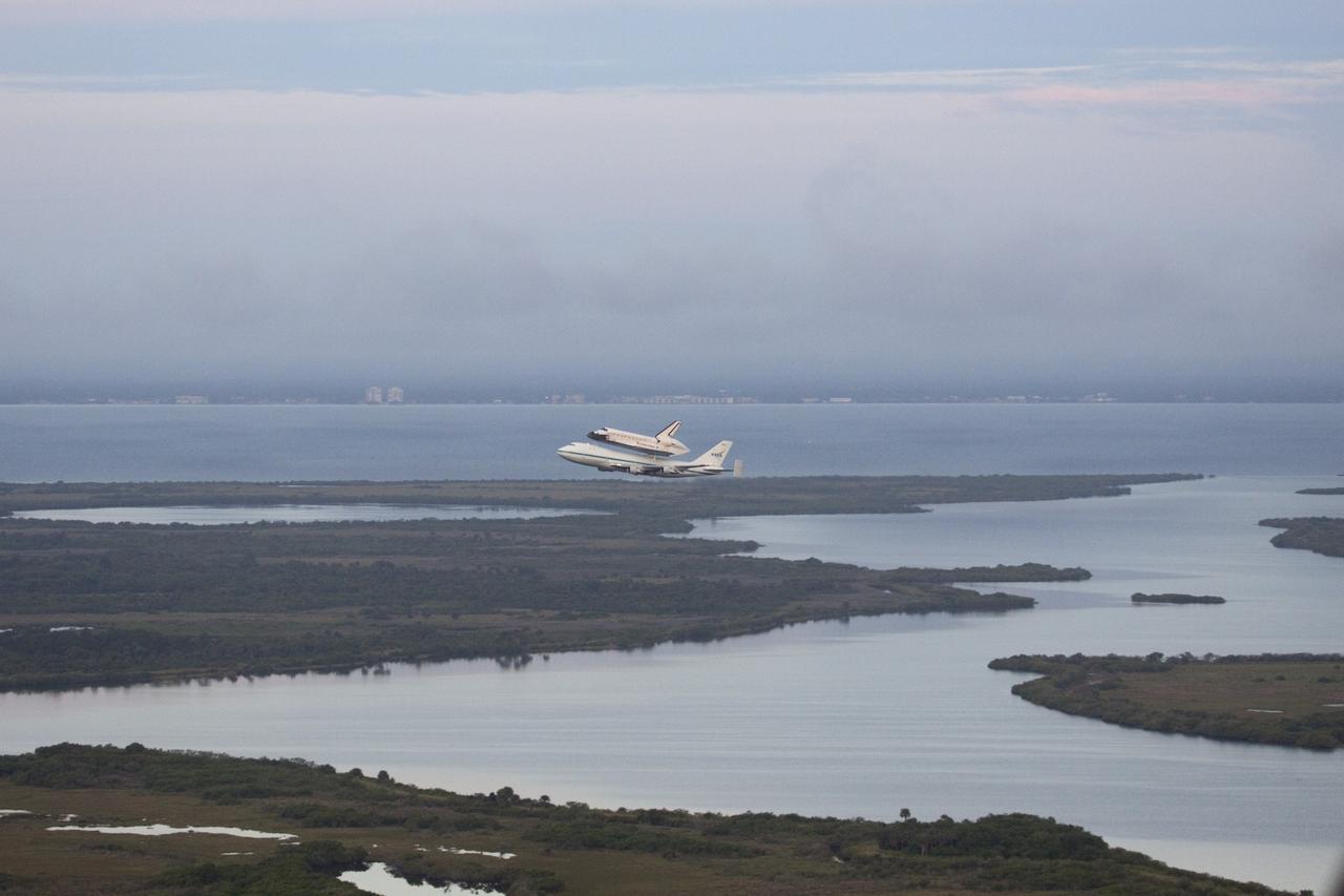 CAPE CANAVERAL, Fla. – At the Shuttle Landing Facility at NASA's Kennedy Space Center in Florida, NASA's Shuttle Carrier Aircraft, or SCA, with the space shuttle Endeavour mounted atop, has just taken off for its ferry flight to California.      The SCA, a modified 747 jetliner, will fly Endeavour to Los Angeles where it will be placed on public display at the California Science Center. This is the final ferry flight scheduled in the Space Shuttle Program era. For more information on the shuttles' transition and retirement, visit http://www.nasa.gov/transition.  Photo credit: NASA/Jim Grossmann
